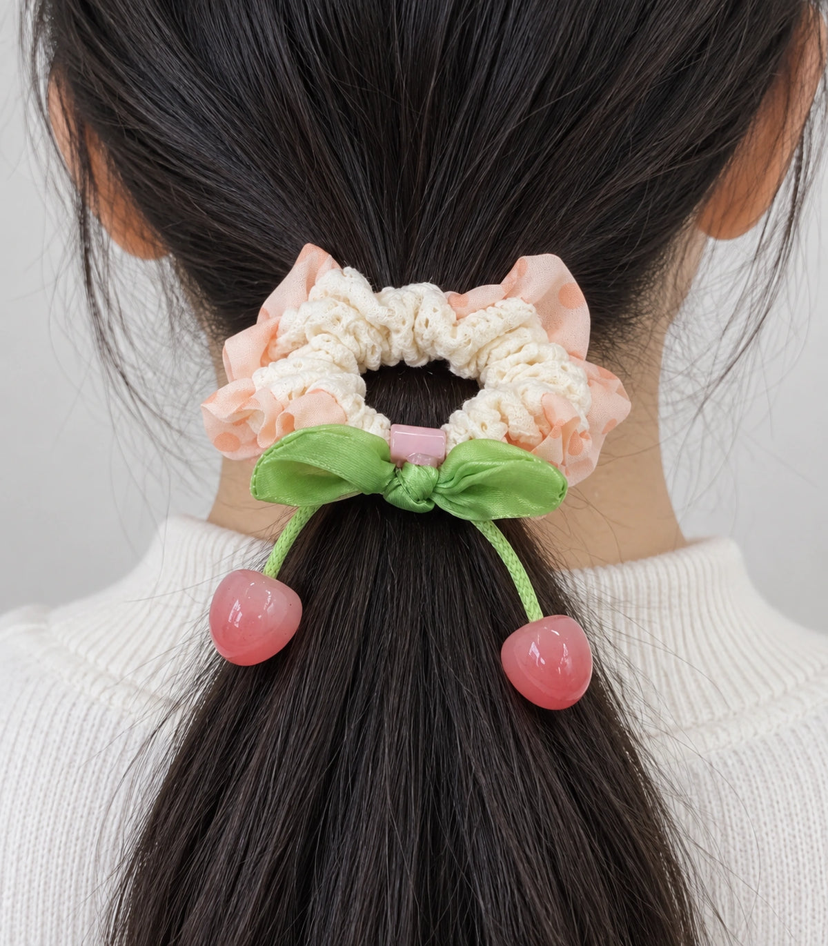 JIMIKI Polka Dot Lace Scrunchie With Cherry Charms in Peach, close-up detail #color_peach
