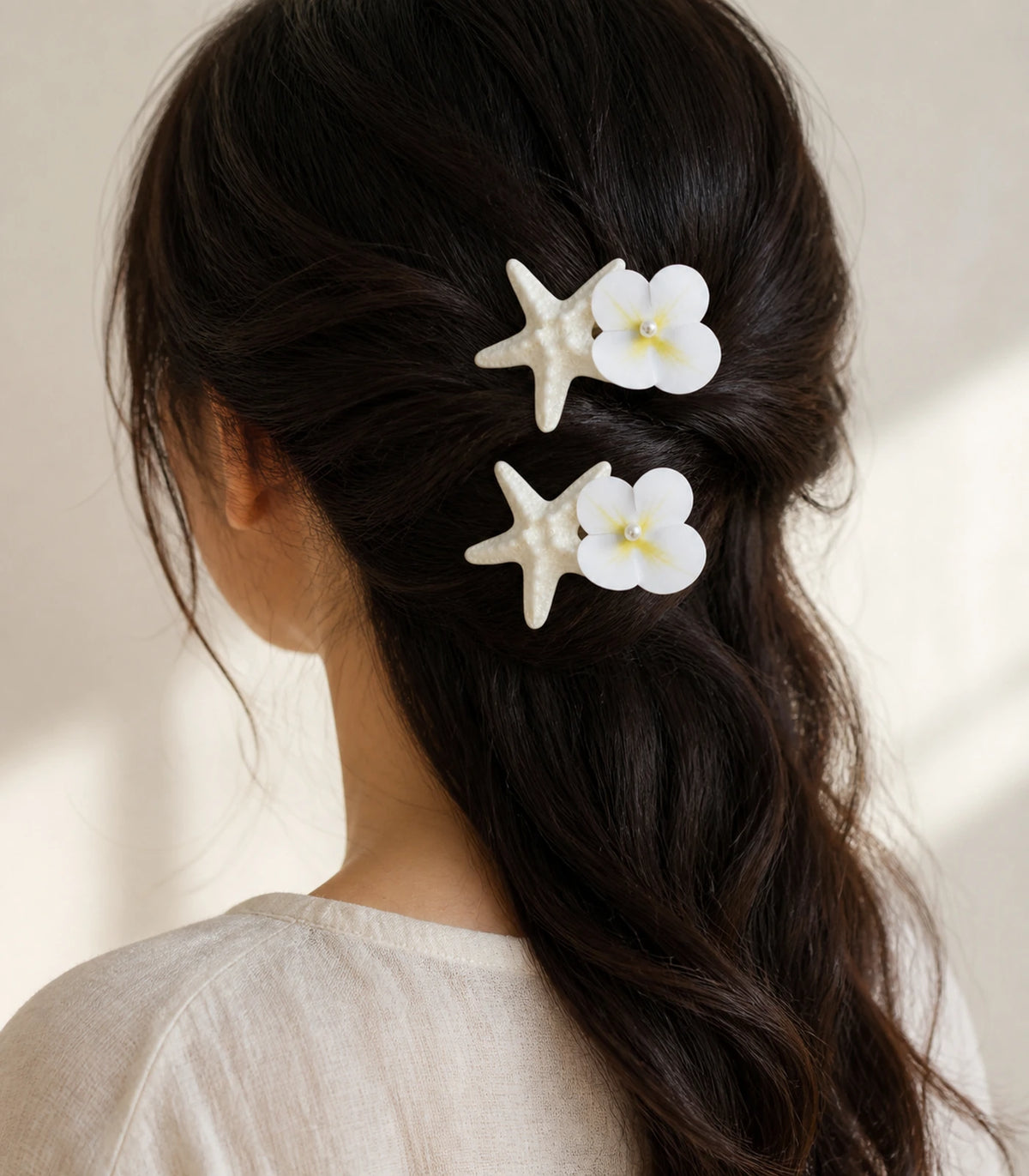 Editorial model view of the Pearly Starfish Flower Clip Pair