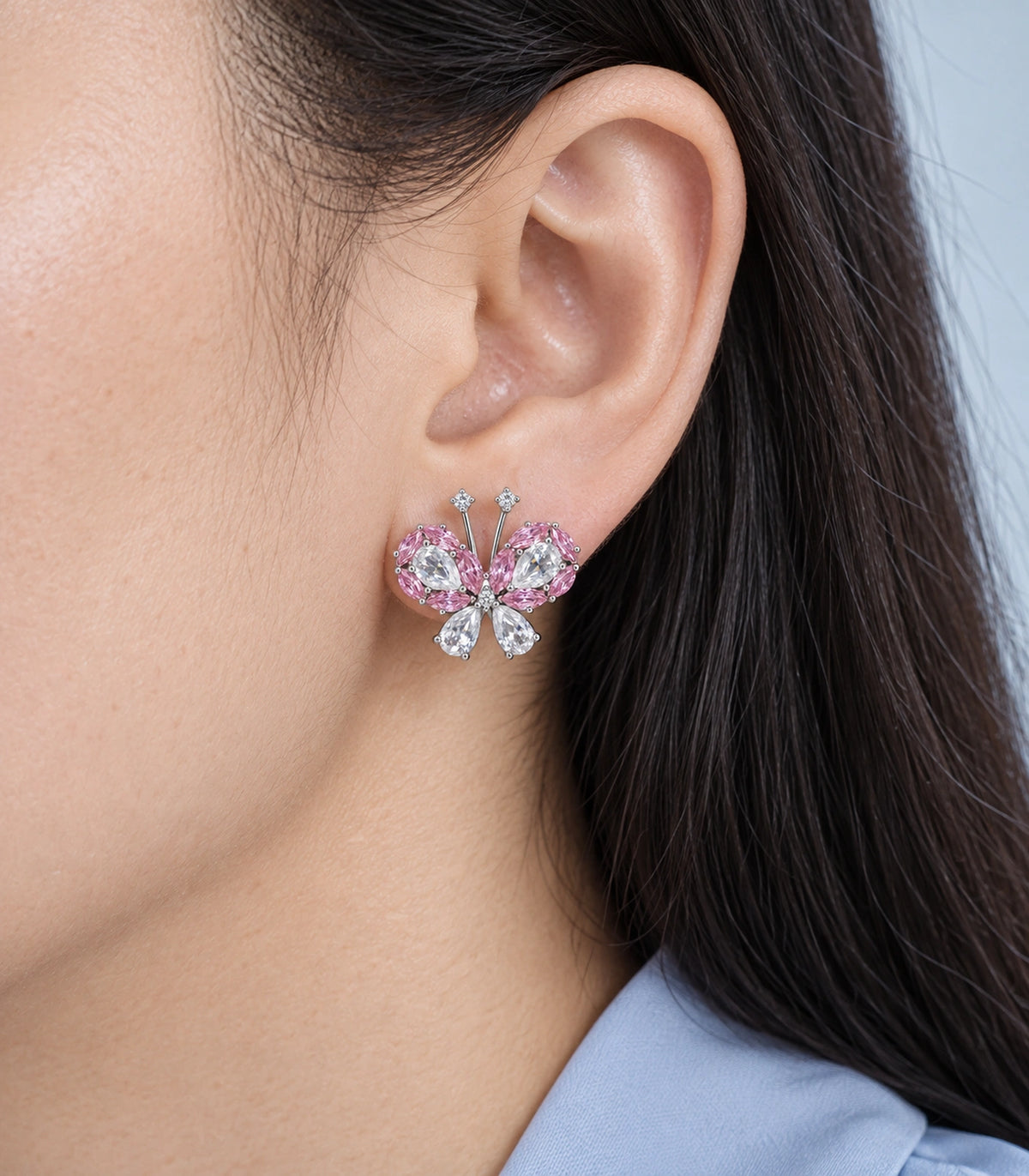 JIMIKI Crystal Butterfly Stud Earring Pair in Pink / silver tone, close-up detail #color_pink / silver tone