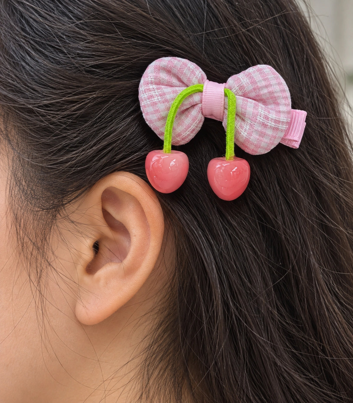 JIMIKI Pink Gingham Bow Hair Clip with Cherry Charms in Pink, close-up detail