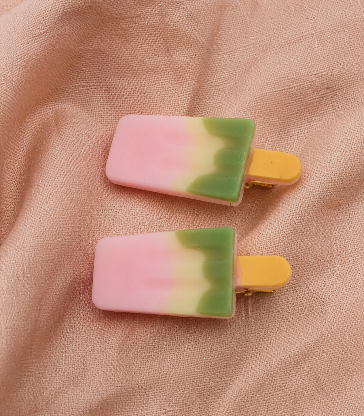 Pink Green Popsicle Clip Pair in close-up detail