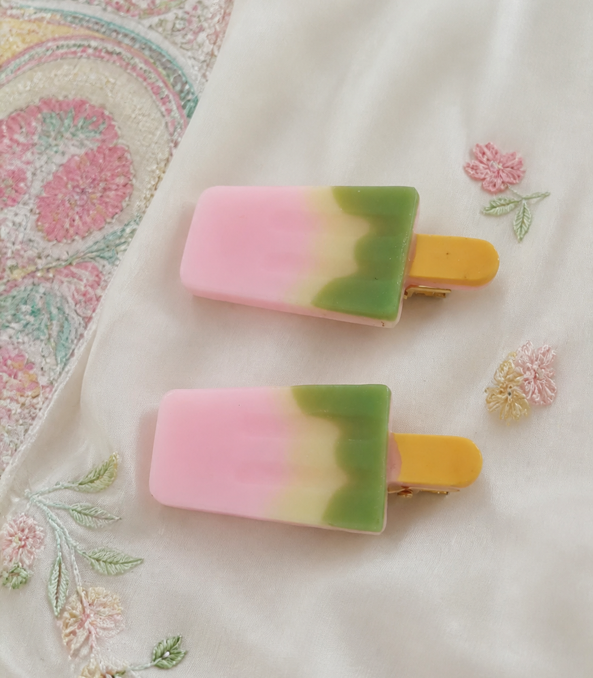 Pink Green Popsicle Clip Pair in an editorial flat lay