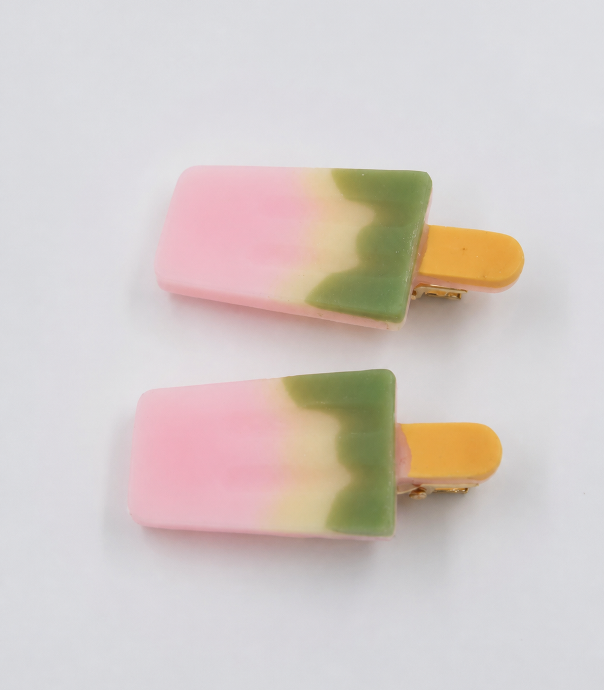 Pink Green Popsicle Clip Pair on a white background