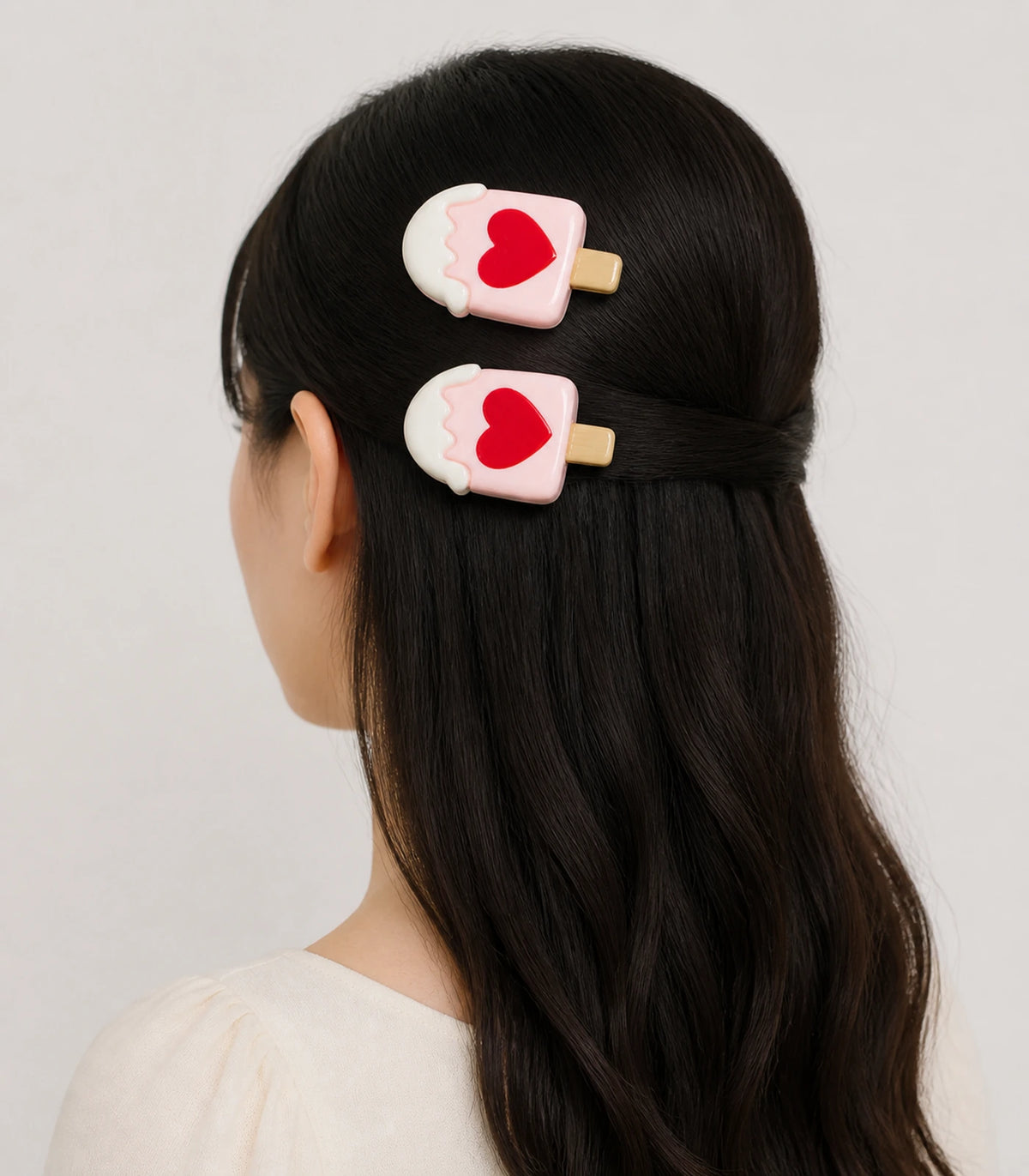 Editorial model view of the Pink Heart Frosted Popsicle Clip Pair