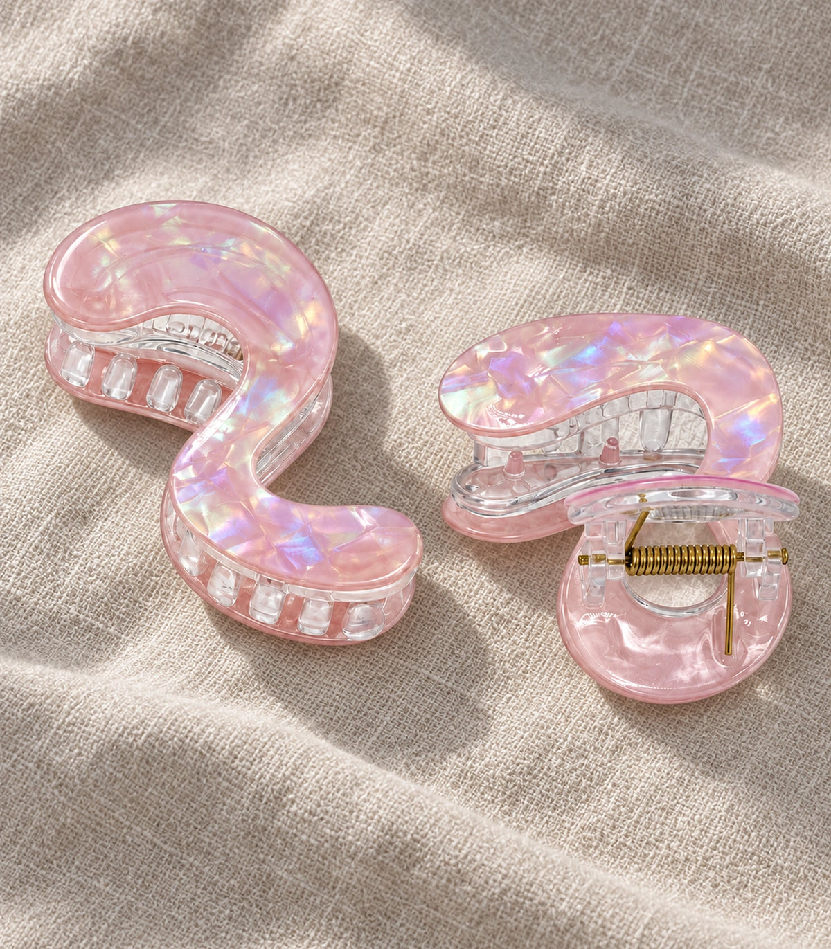 JIMIKI Iridescent S Shaped Hair Claw Clips in Pink, editorial flat lay #color_pink