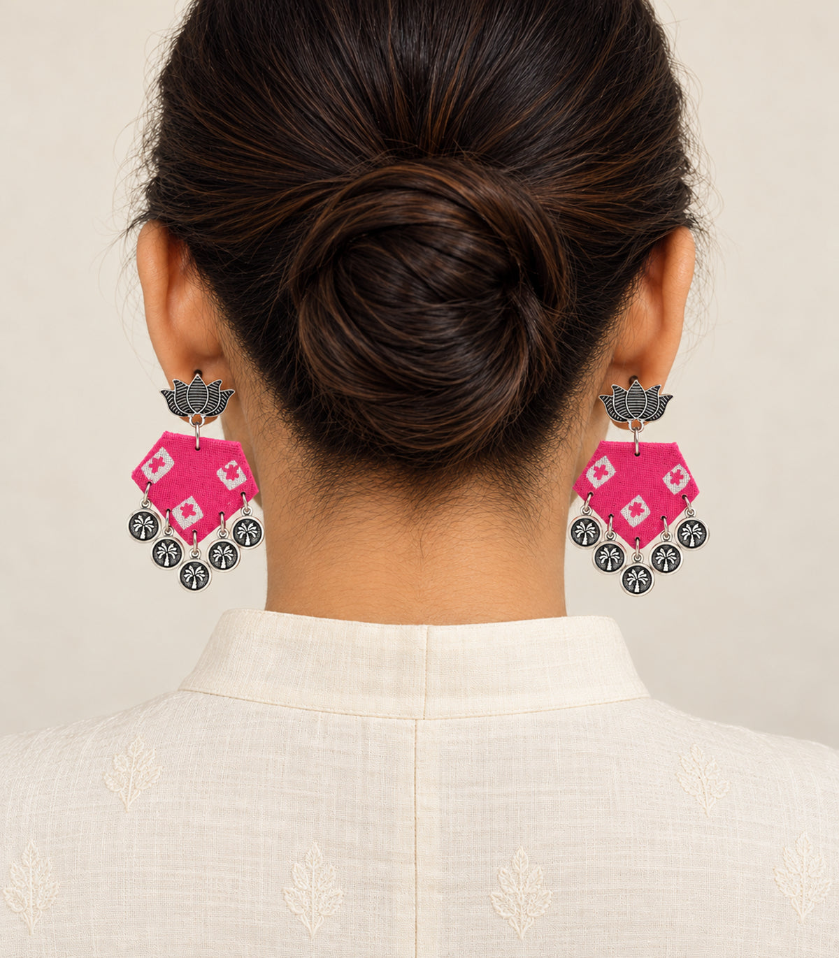 Pink and ivory lotus hexagon coin earrings — model view
