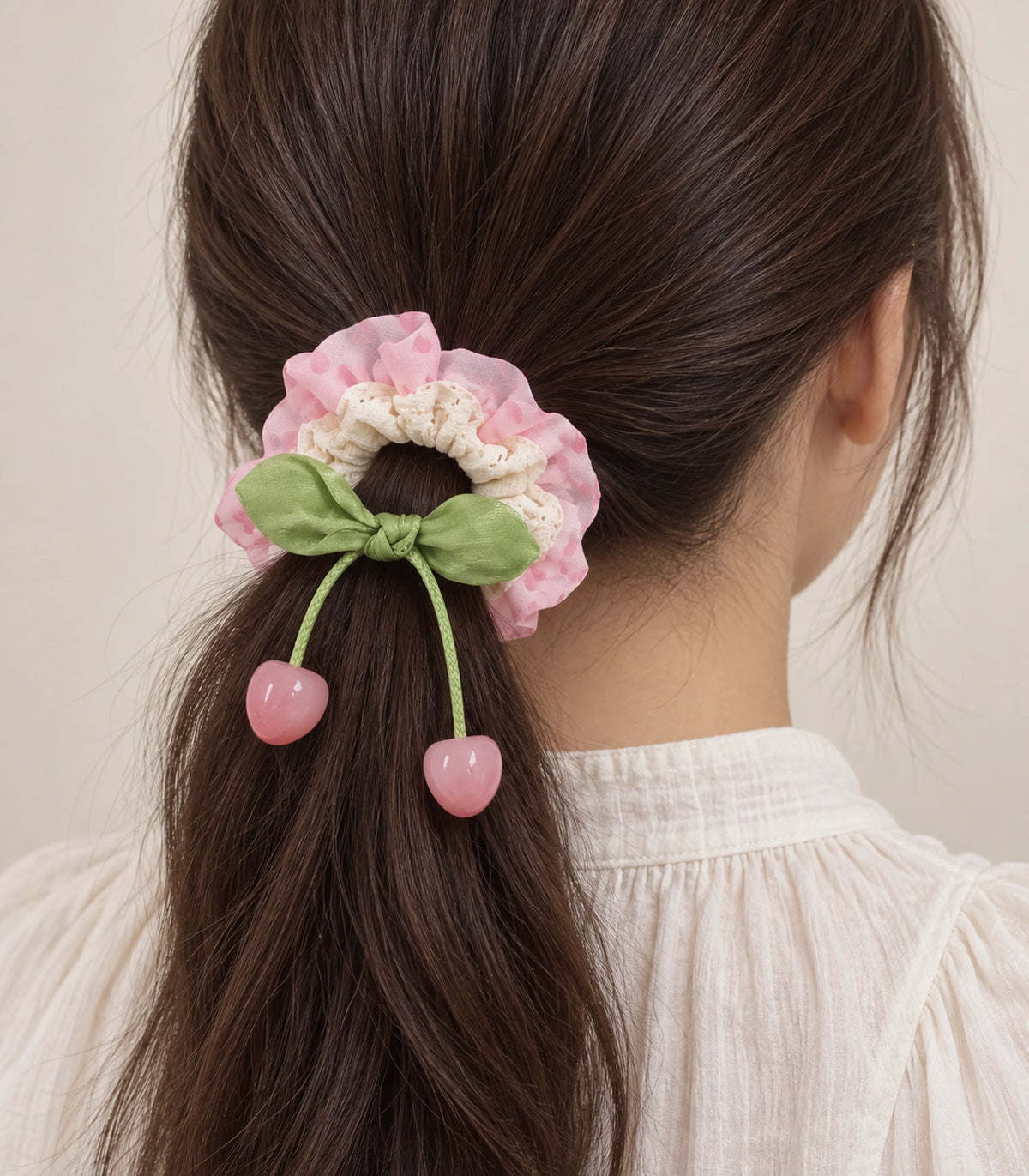 JIMIKI Polka Dot Lace Scrunchie With Cherry Charms in Pink, model wearing view #color_pink