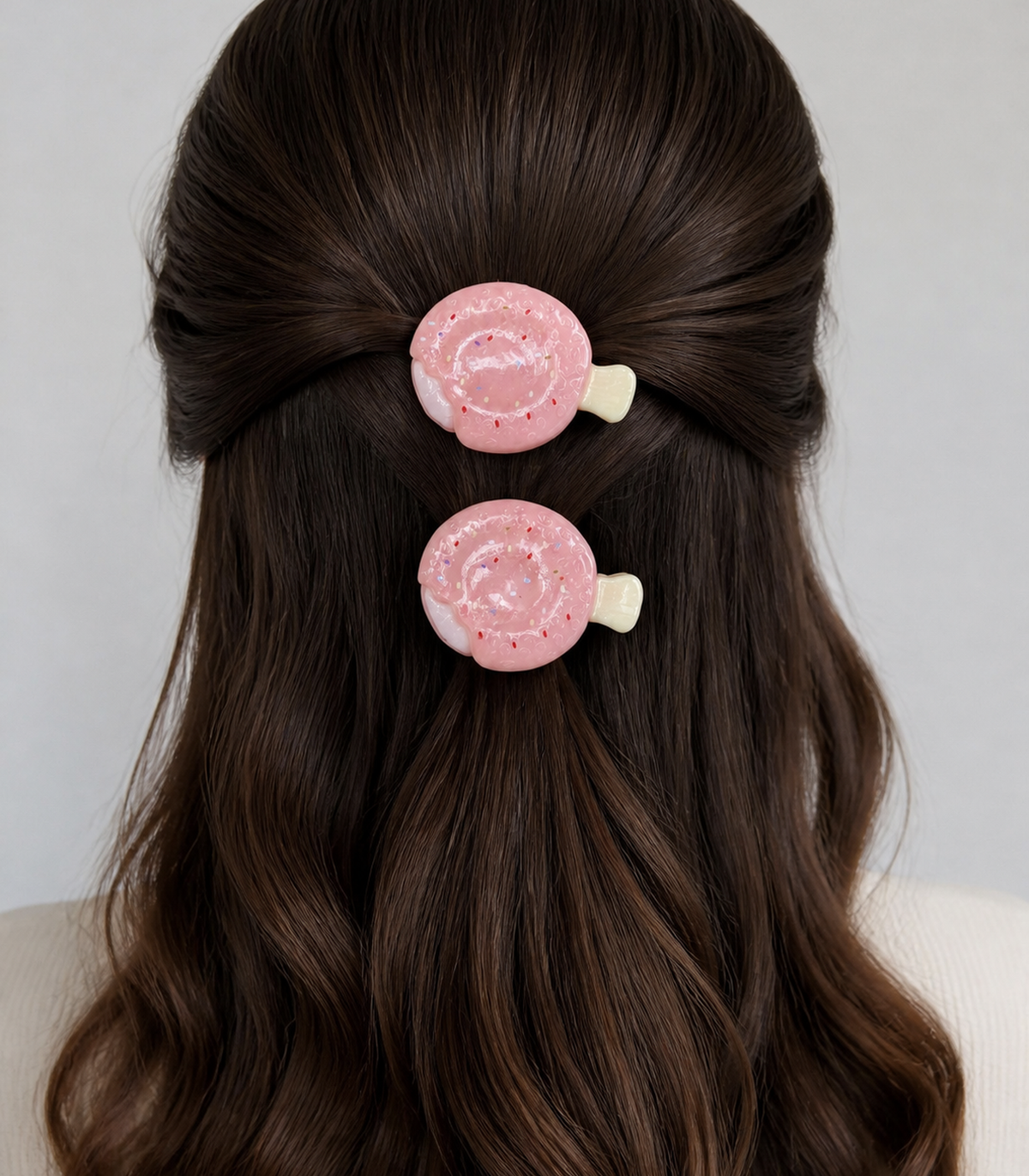 Pink Swirled Pastry Barrette Pair styled editorial view