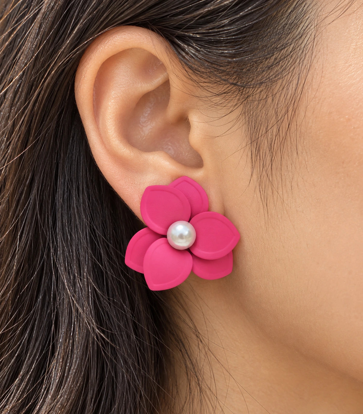 JIMIKI Pink Triple Petal Pearl Flower Stud Earrings - layered petals and pearl-style centre worn close-up #color_pink