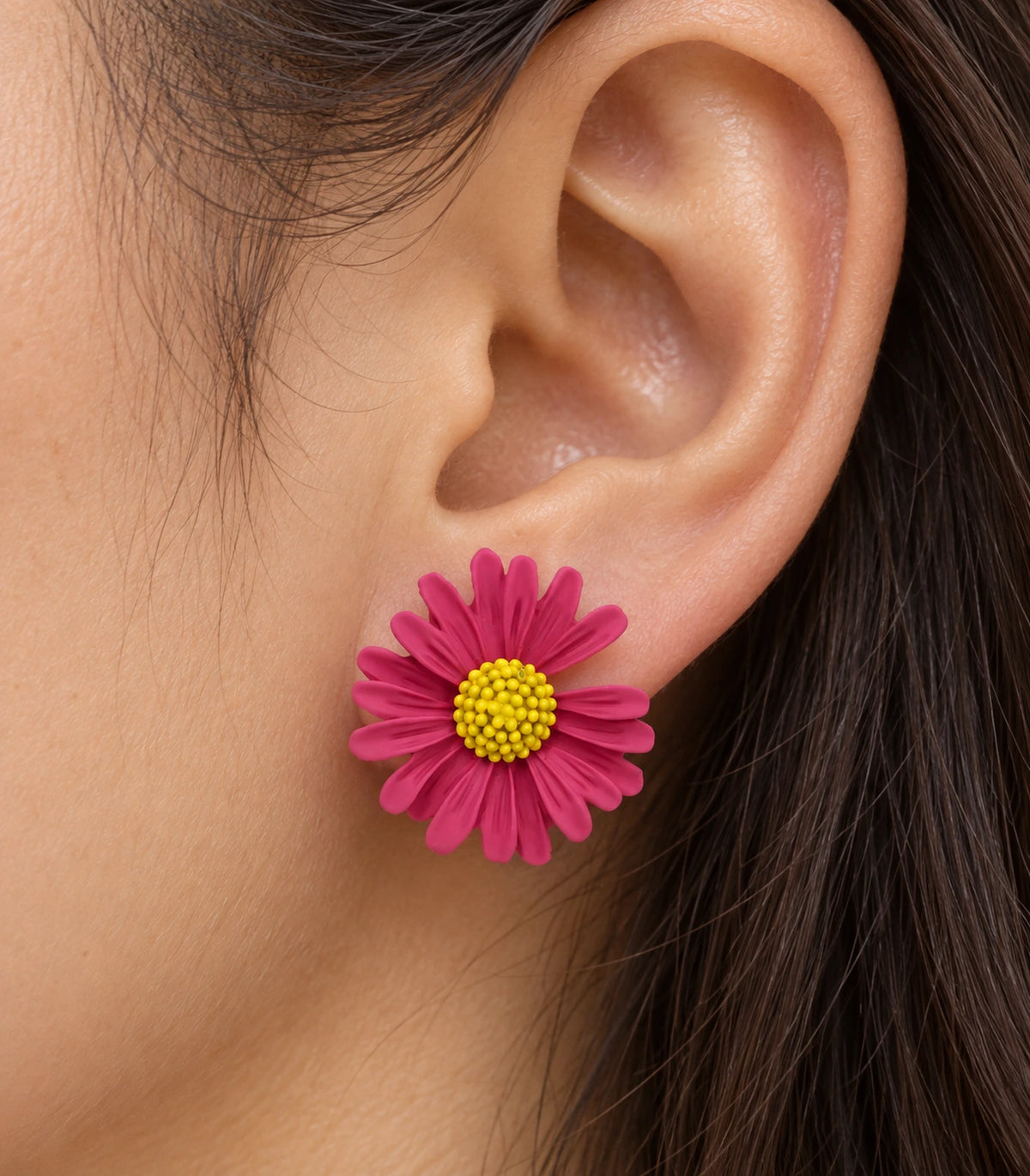 JIMIKI Pink yellow centre daisy stud earrings, close-up of grooved petals and yellow centre #color_pink