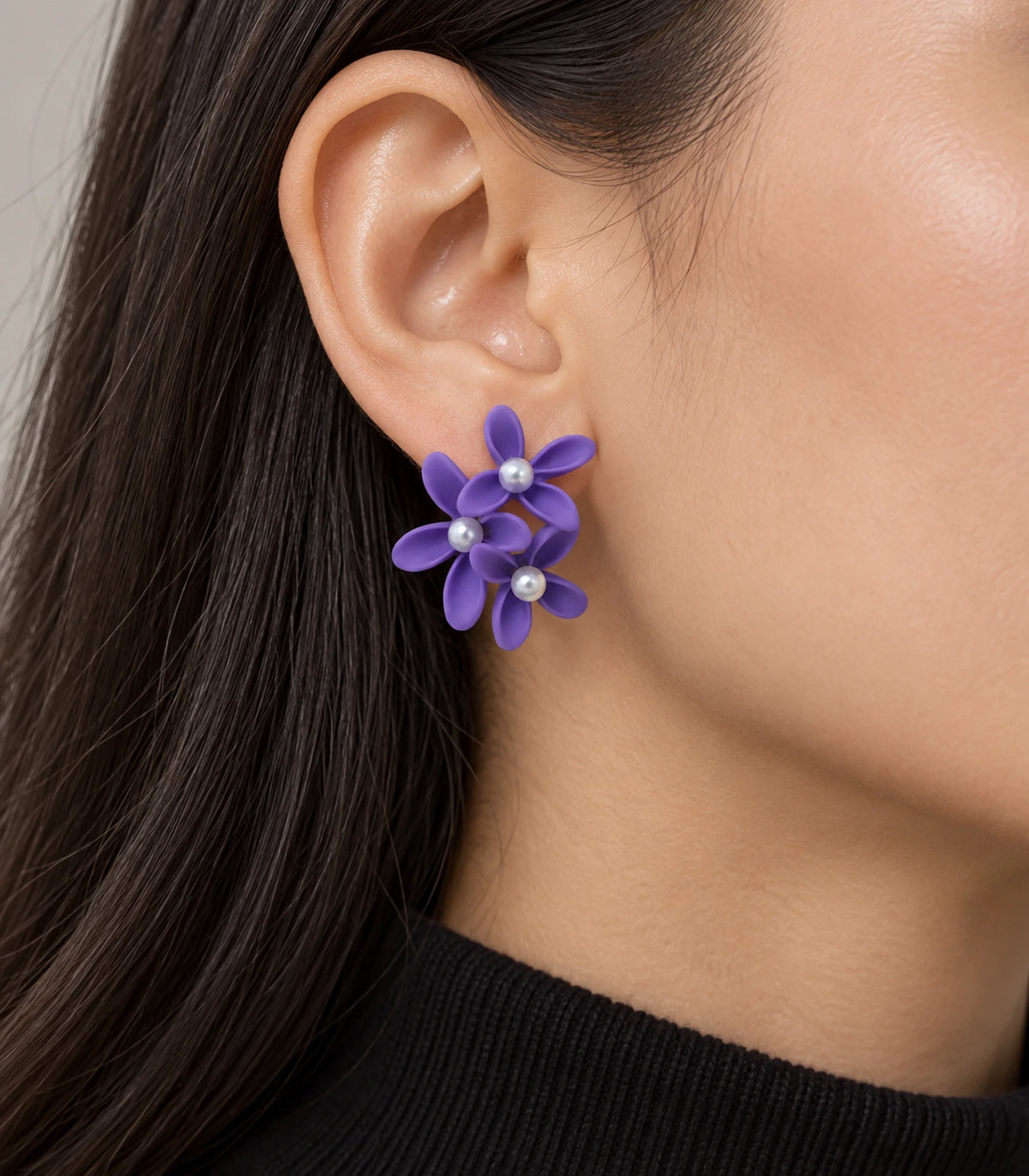 JIMIKI Purple cascading floral cluster stud earrings, worn on the ear with the floral cluster visible #color_purple