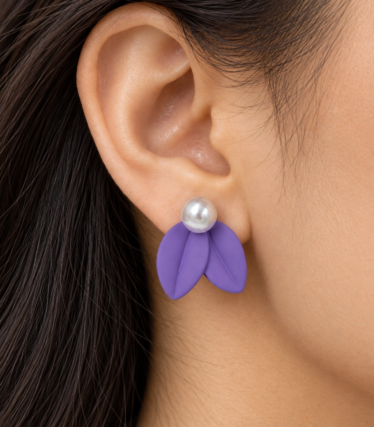 JIMIKI Double Leaf Pearl Stud Earrings in Purple — close-up of the earring worn on the ear #color_purple