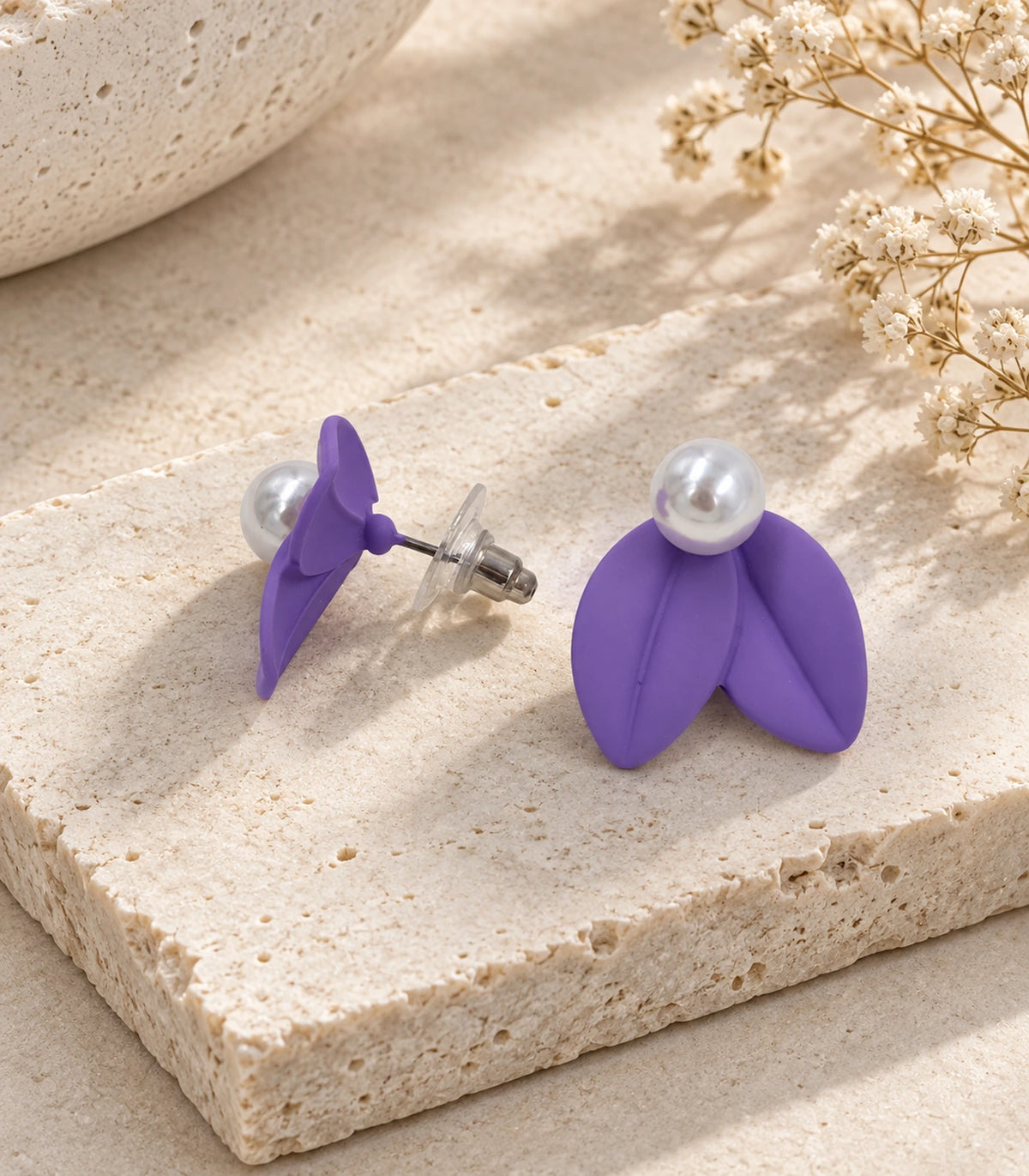 JIMIKI Double Leaf Pearl Stud Earrings in Purple — pair in a styled flat lay #color_purple
