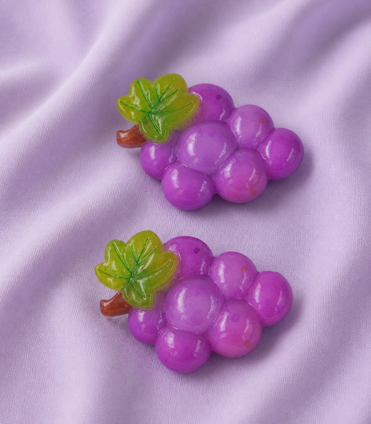 Editorial flat lay of the Purple Grape Cluster Clip Pair