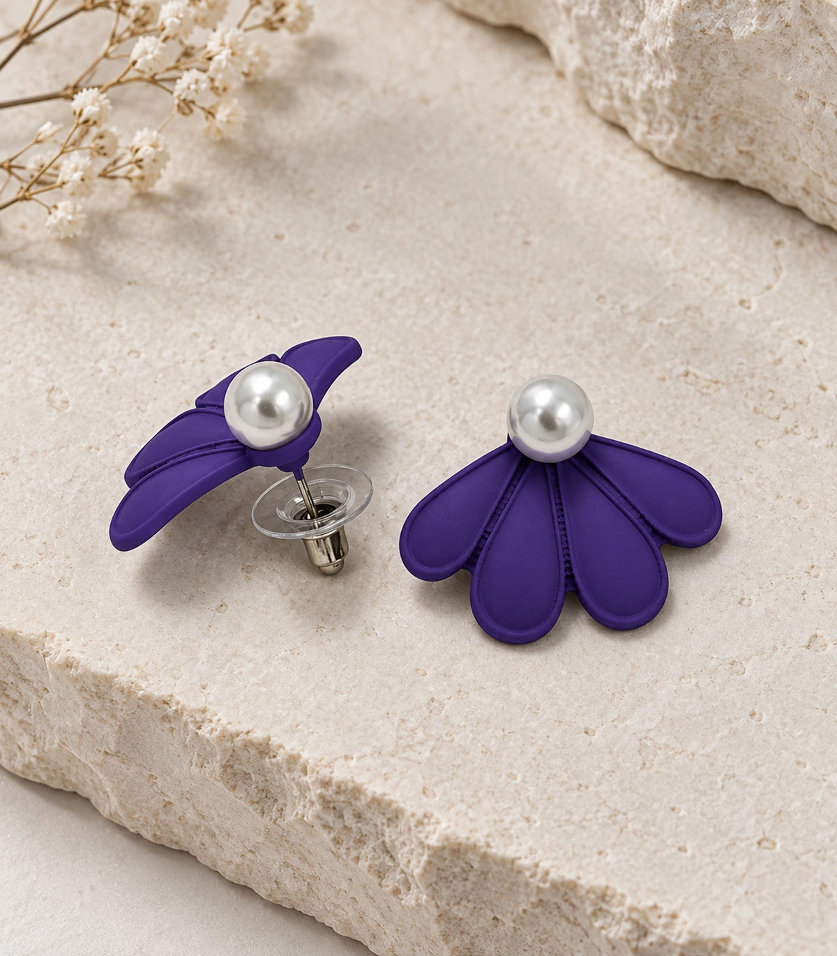 JIMIKI Purple pearl fan petal stud earrings, pair in an editorial flat lay #color_purple