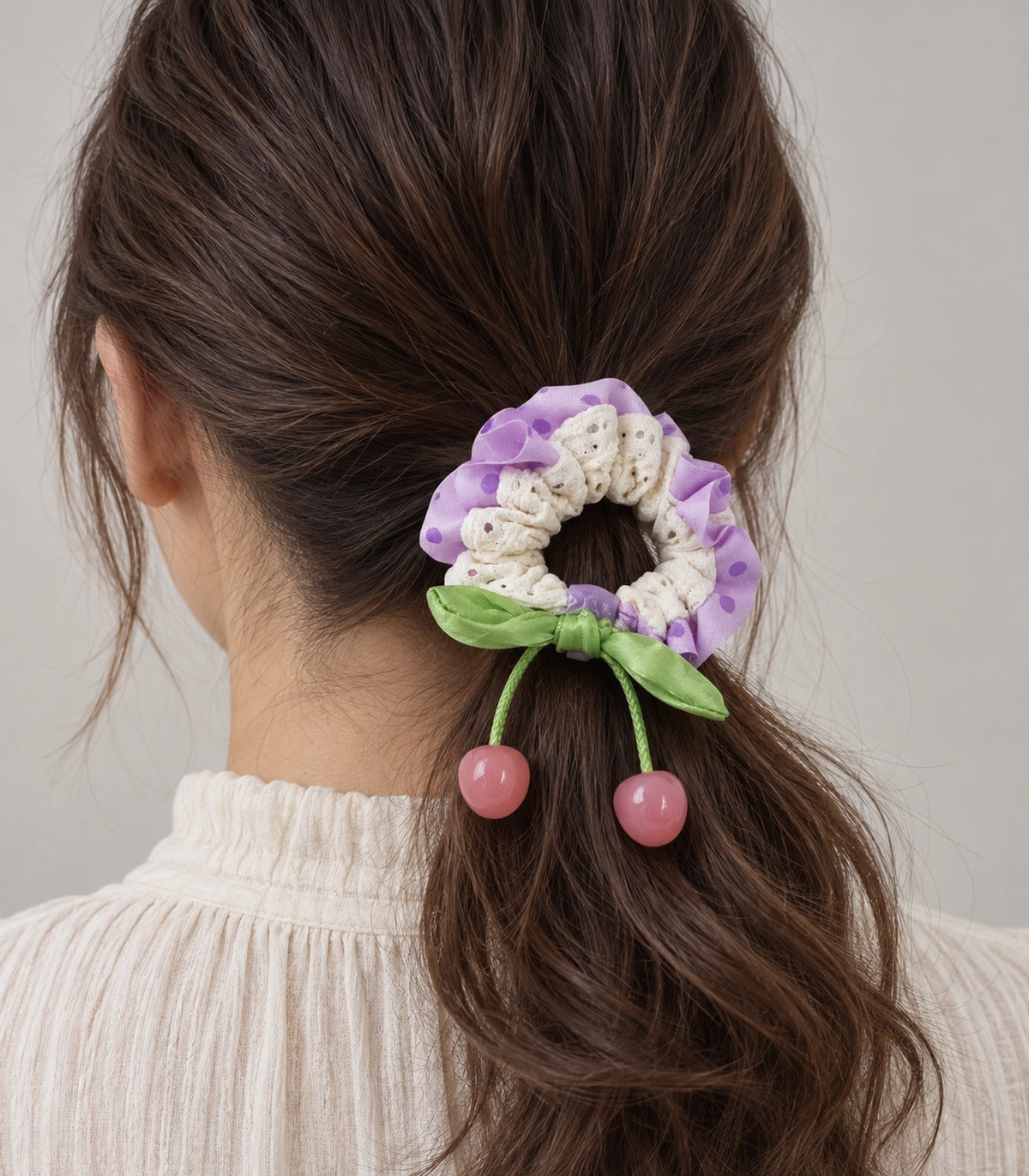 JIMIKI Polka Dot Lace Scrunchie With Cherry Charms in Purple, model wearing view #color_purple