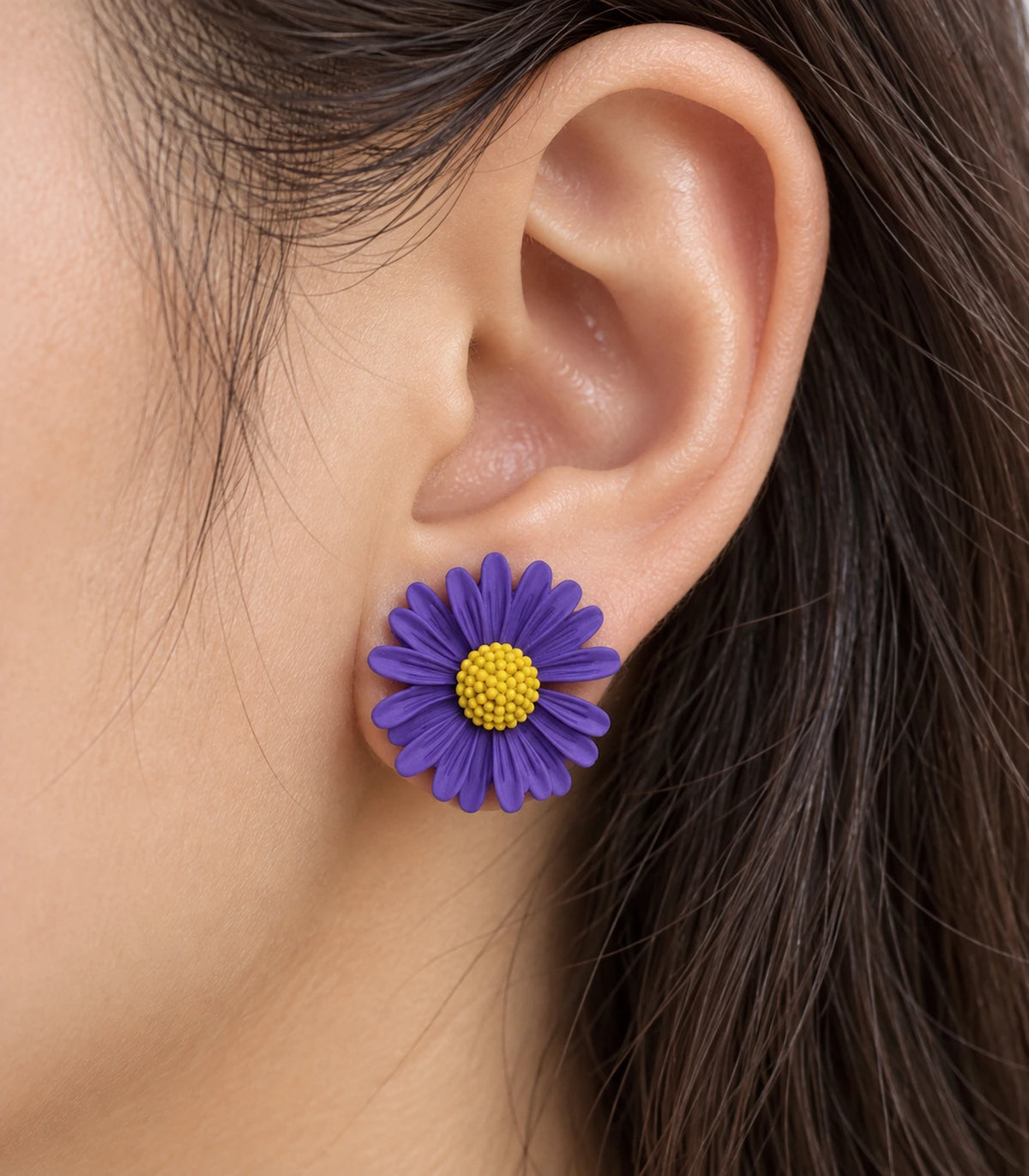 JIMIKI Purple yellow centre daisy stud earrings, close-up of grooved petals and yellow centre #color_purple