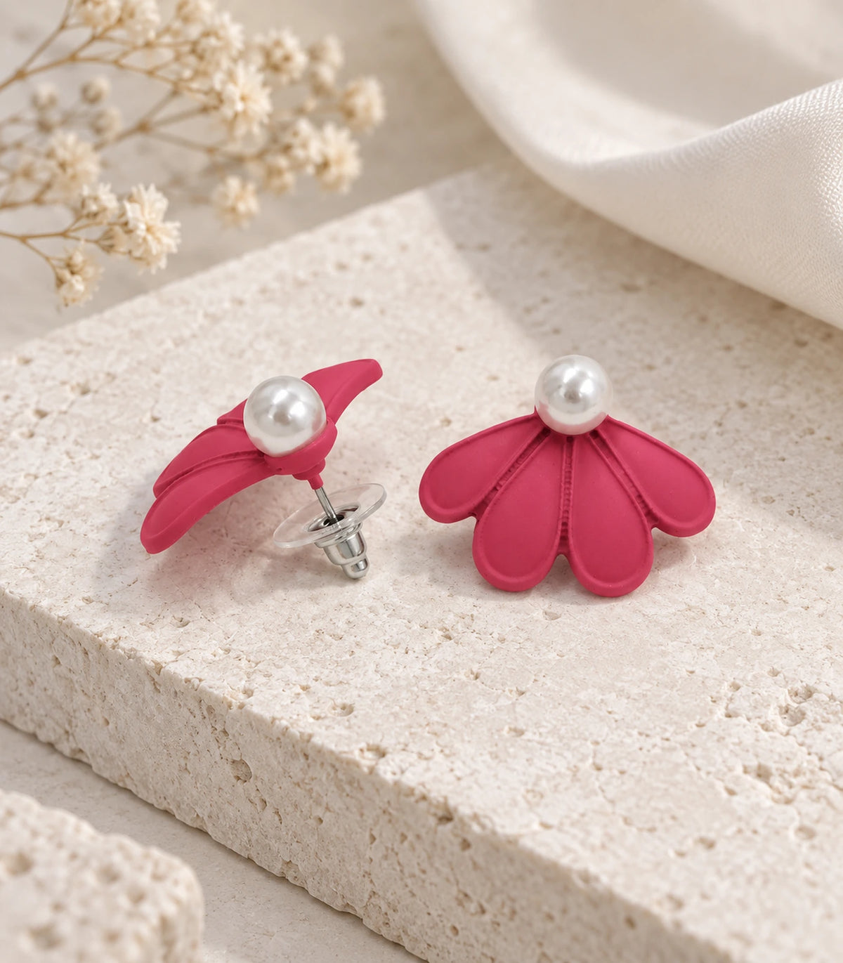 JIMIKI Raspberry Pink pearl fan petal stud earrings, pair in an editorial flat lay #color_raspberry pink