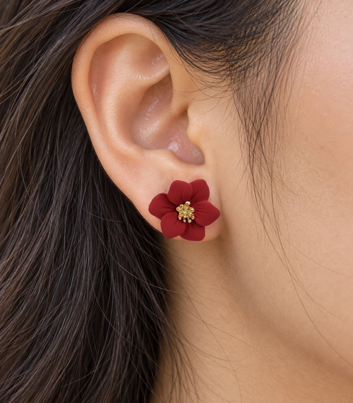 JIMIKI Red compact six petal flower stud earrings, close-up of six rounded petals and gold-tone centre #color_red