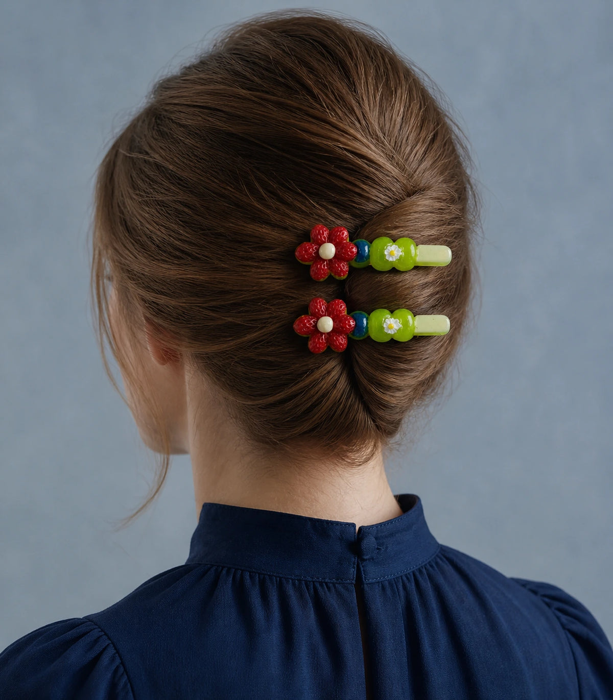 Editorial model view of the Red Flower Green Daisy Barrette Pair