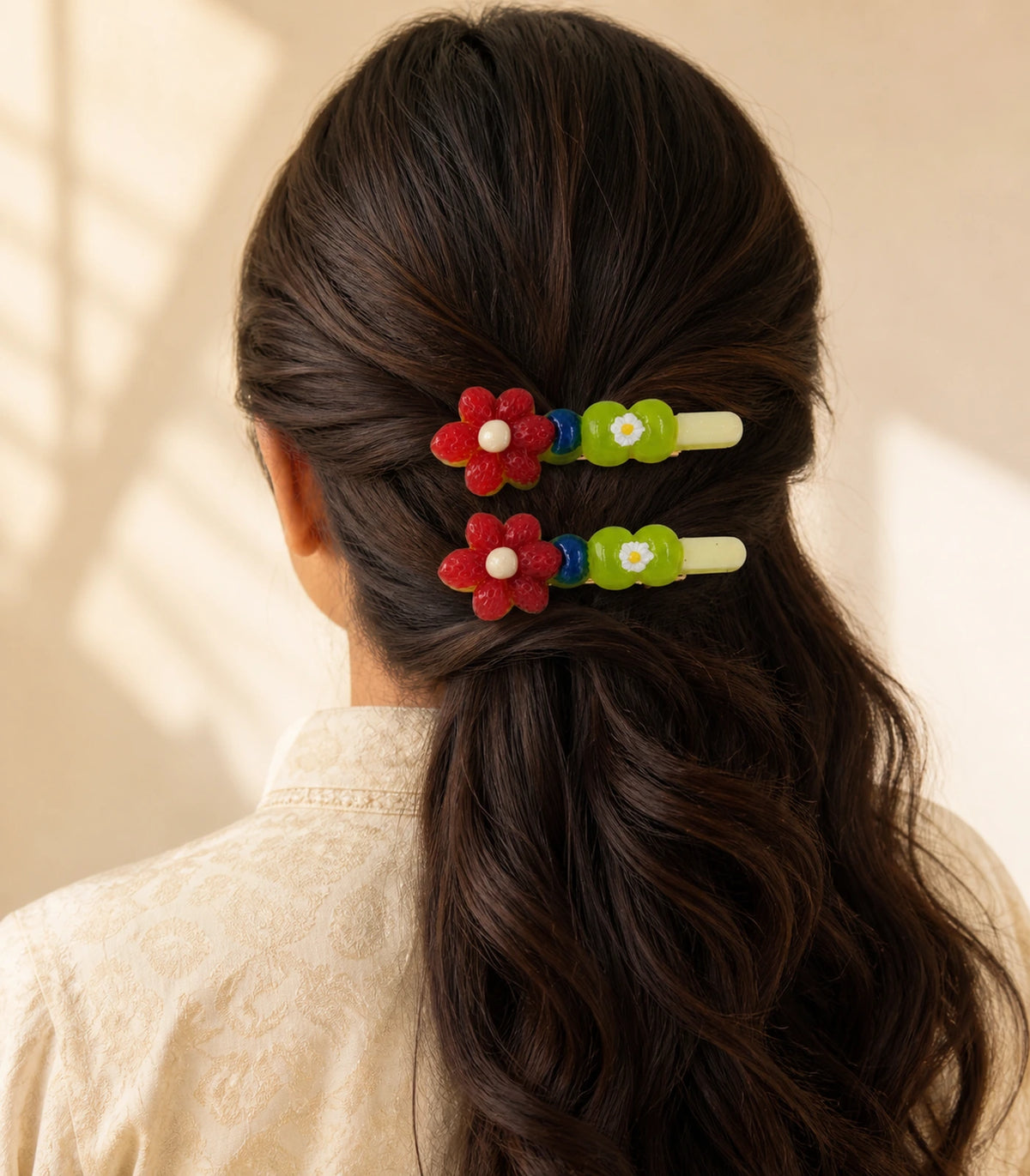 Model wearing the Red Flower Green Daisy Barrette Pair