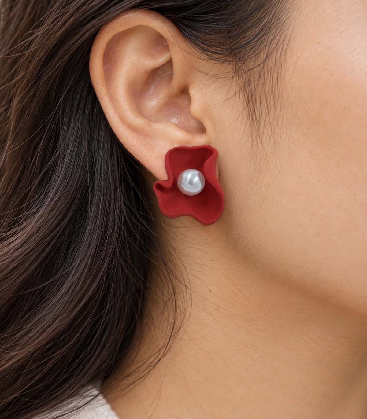 JIMIKI Folded Calla Pearl Stud Earrings, Red — worn close-up showing petal detail #color_red