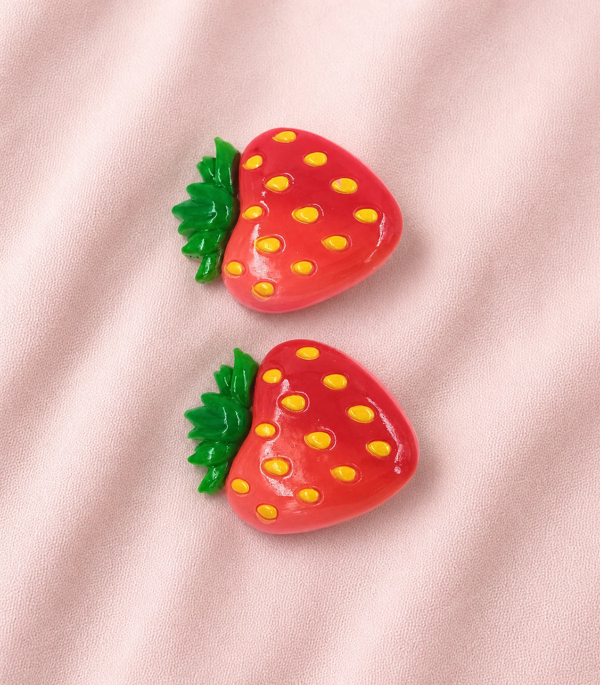 Editorial flat lay of the Red Strawberry Clip Pair