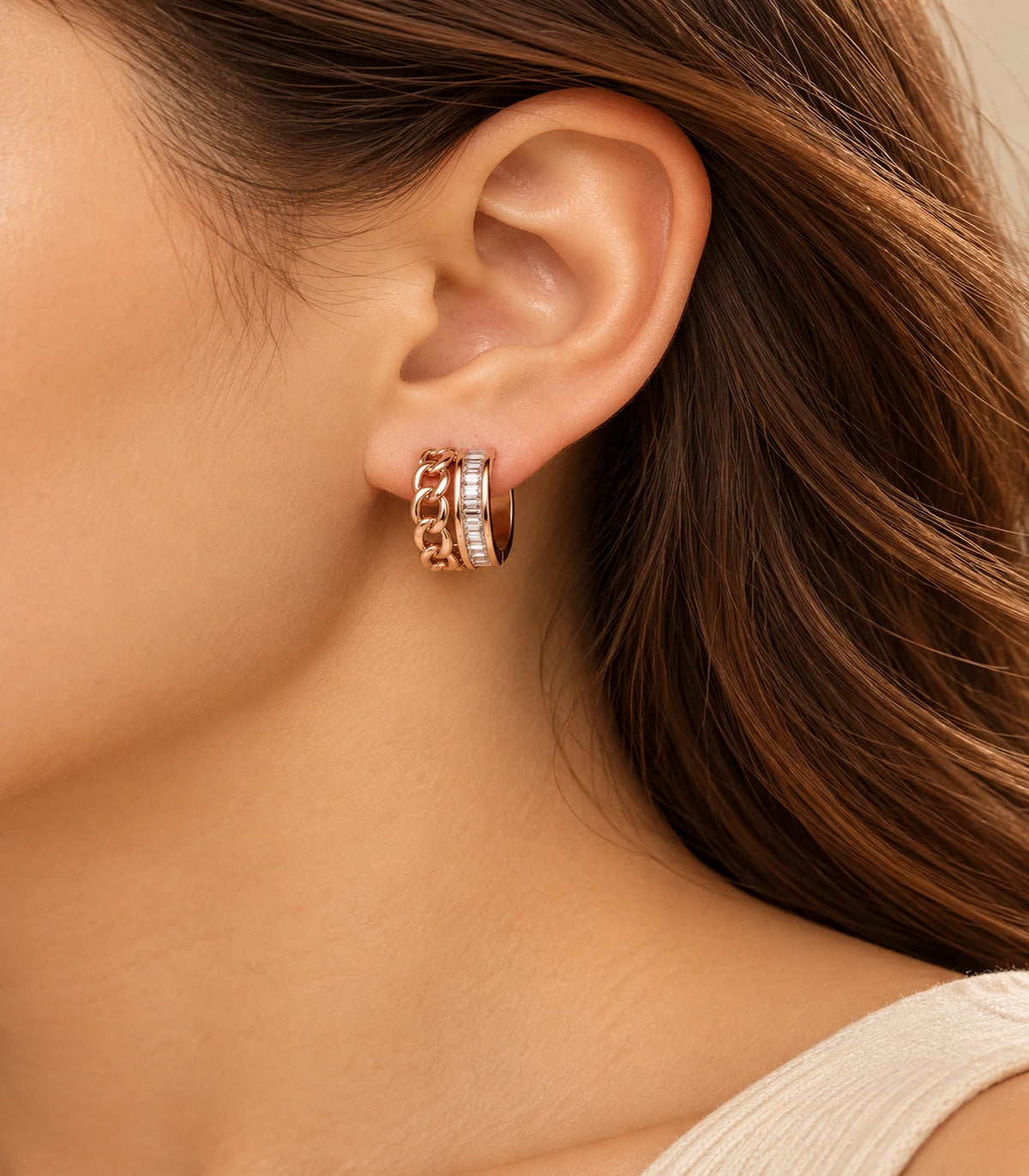 JIMIKI rose gold baguette chain double row huggie earrings, worn in warm editorial lighting #color_rose-gold-tone