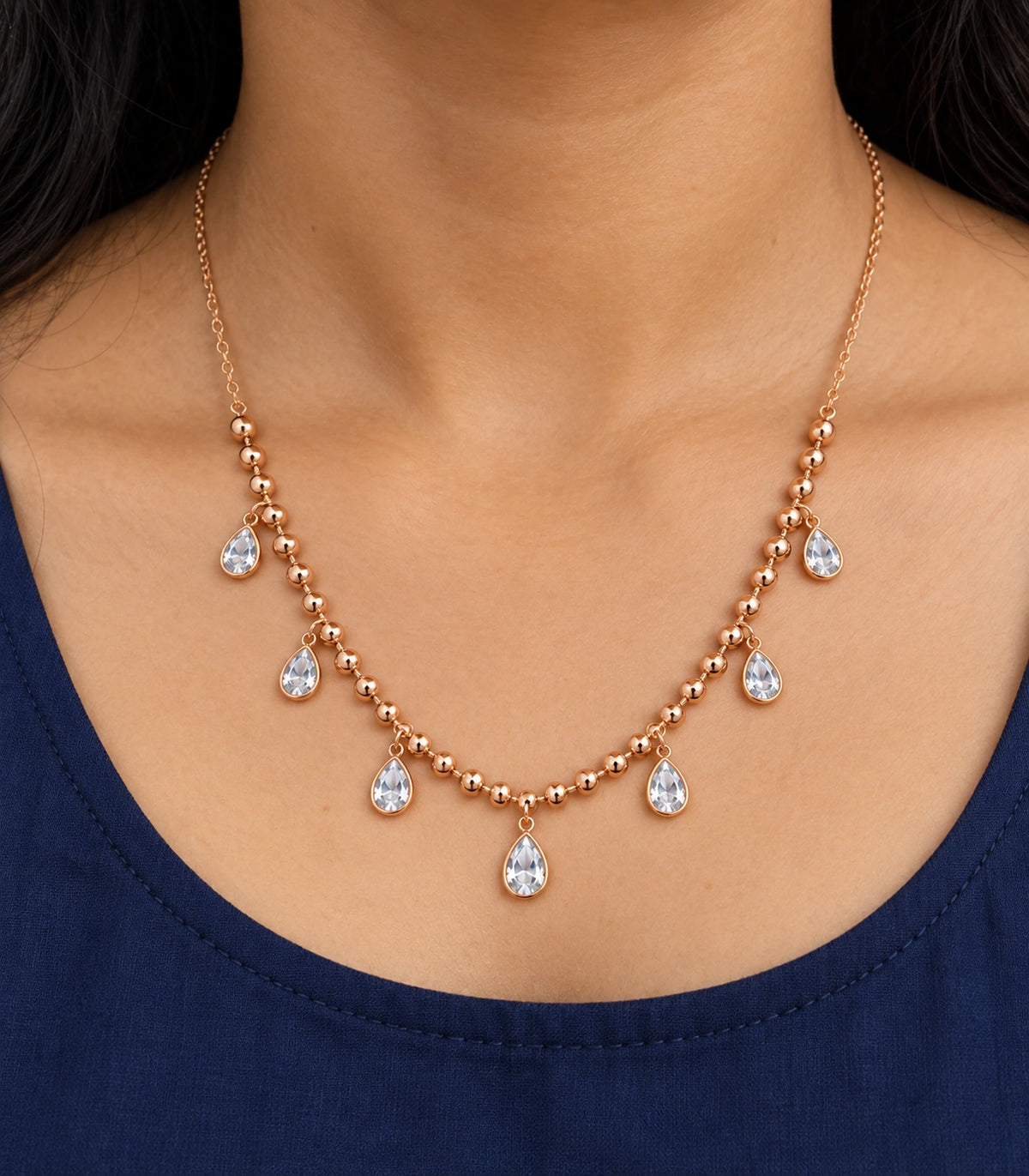 JIMIKI Rose-Gold Bead and Pear-Crystal Drop Necklace in Rose Gold - close-up details #color_rose-gold