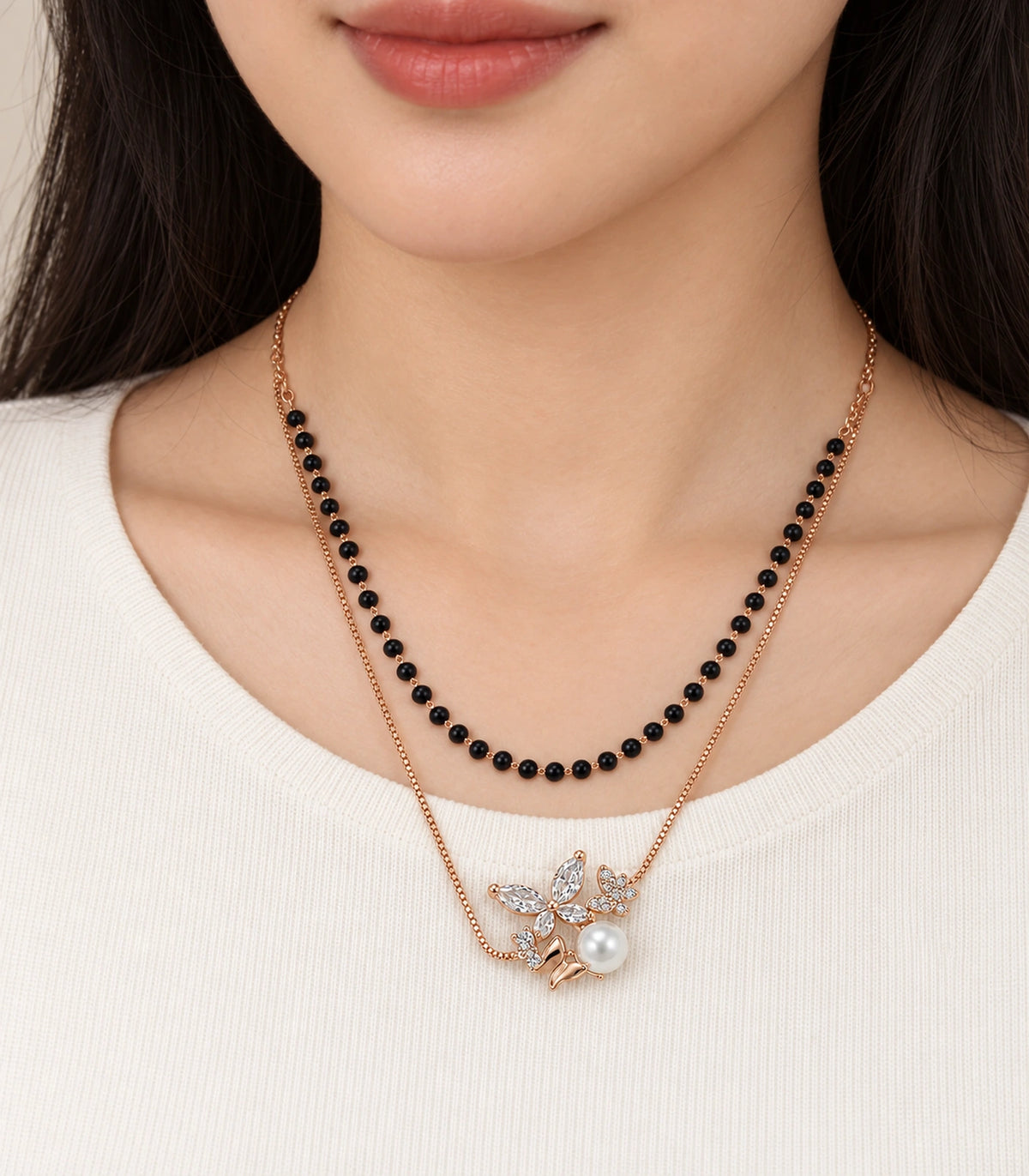 JIMIKI Rose-Gold Black-Bead Crystal-Butterfly Pearl Layered Necklace in Rose Gold / Black - close-up details #color_rose-gold-black