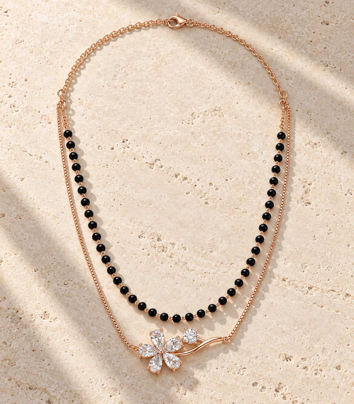 JIMIKI Rose-Gold Black-Bead Crystal-Flower Layered Necklace in Rose Gold / Black - editorial flatlay #color_rose-gold-black