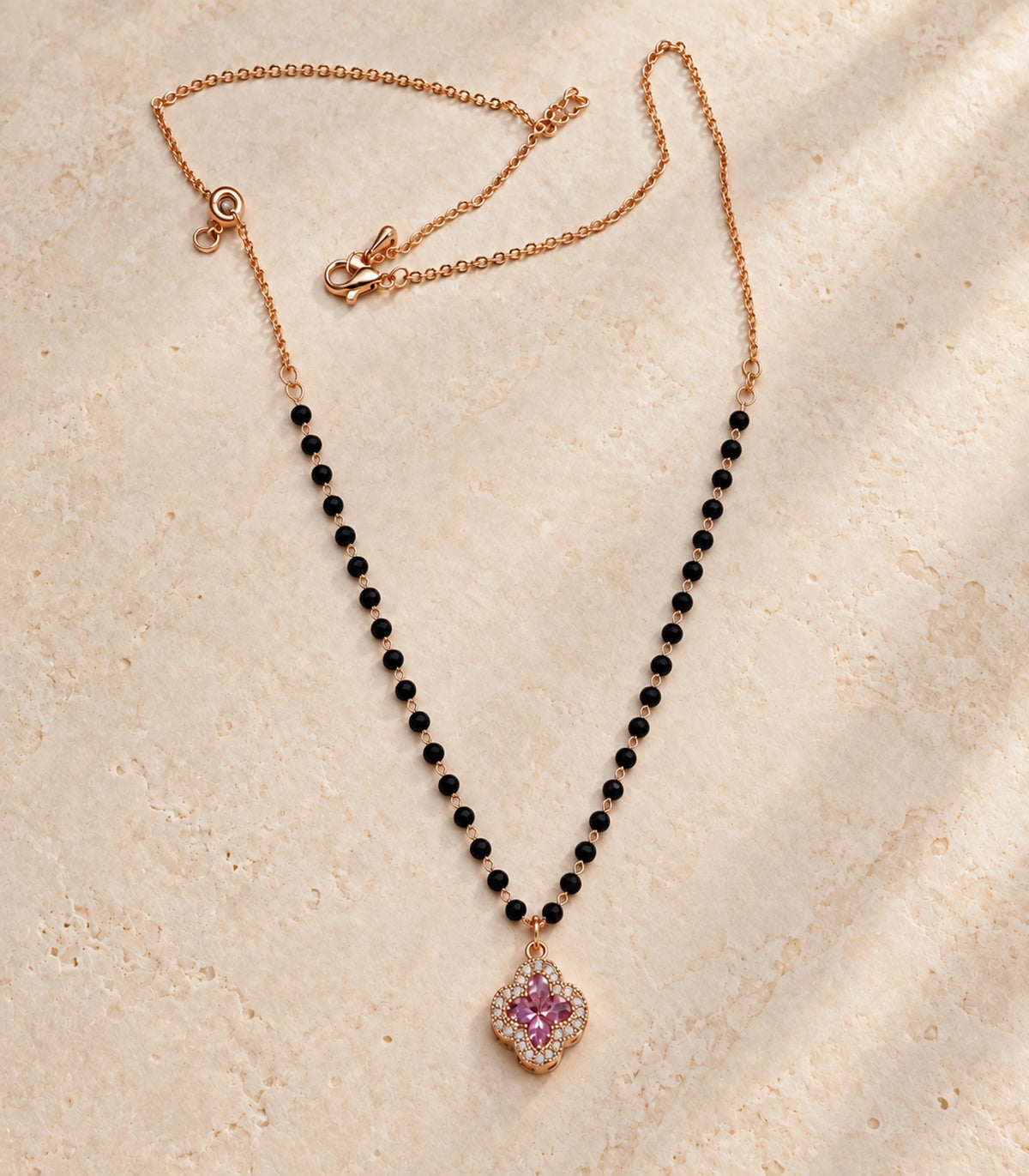 Rose Gold Black Bead Pink Quatrefoil Pendant Necklace – editorial flatlay