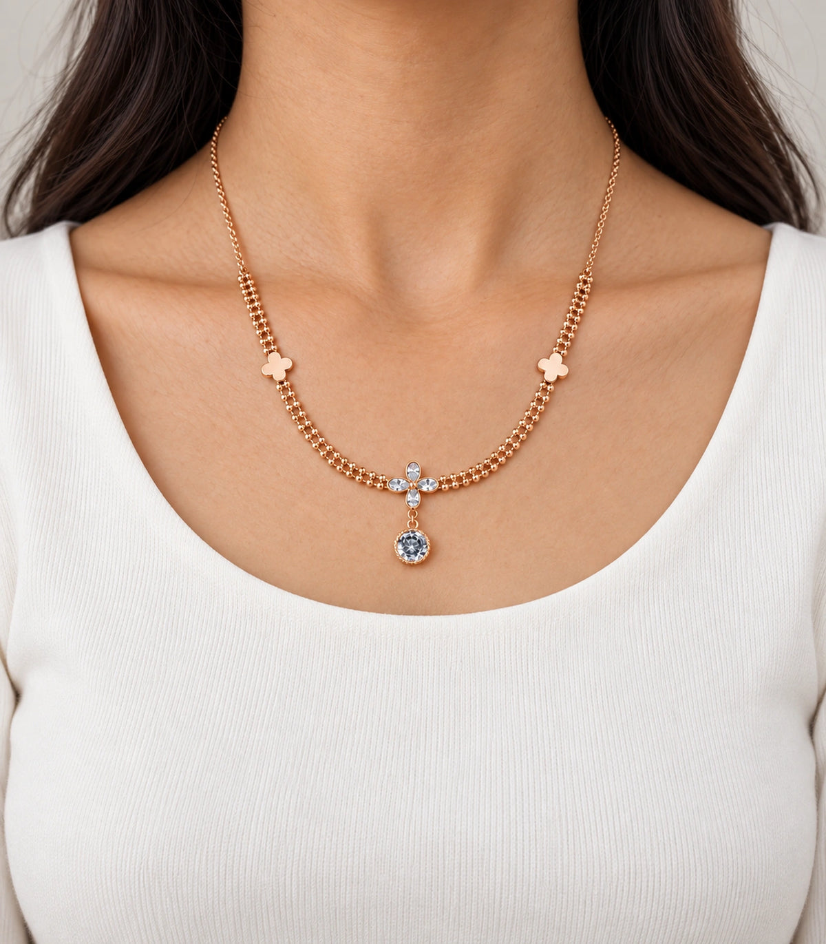 JIMIKI Clover Crystal Flower Drop Necklace in Rose Gold - worn styling view #color_rose-gold