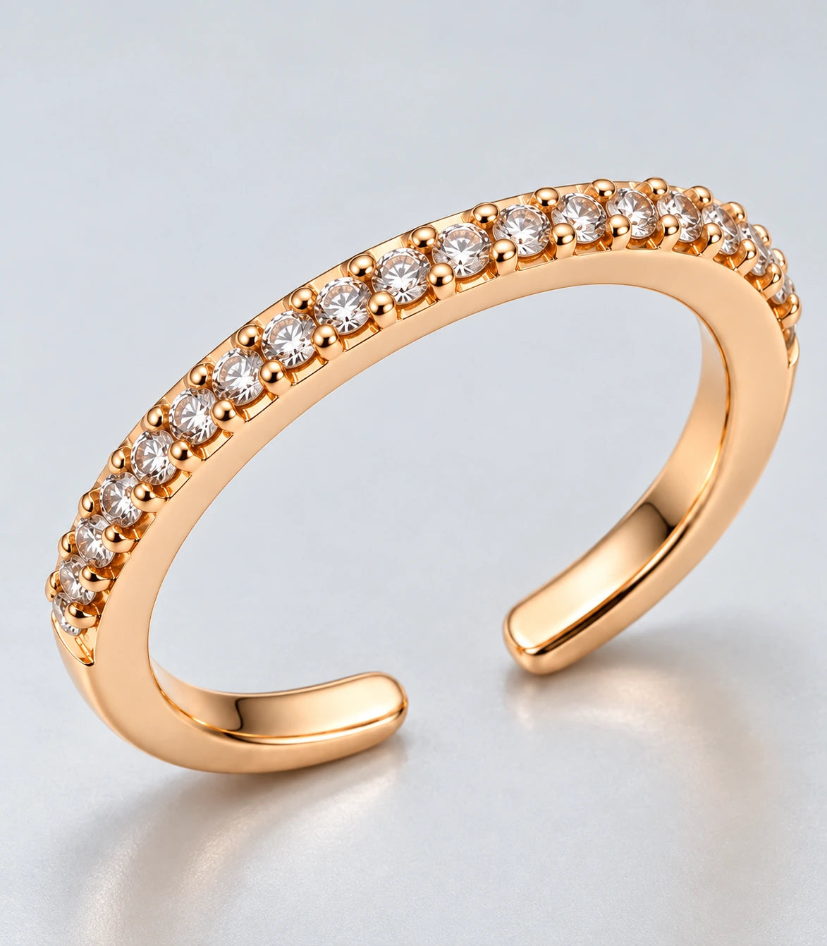 JIMIKI Rose Gold Curved Crystal Row Adjustable Ring in Rose Gold - close-up details #color_rose-gold