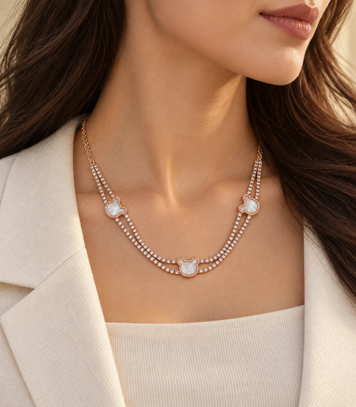 JIMIKI rose-gold-tone double-strand motif necklace, necklace worn with softly lit editorial styling #color_rose gold
