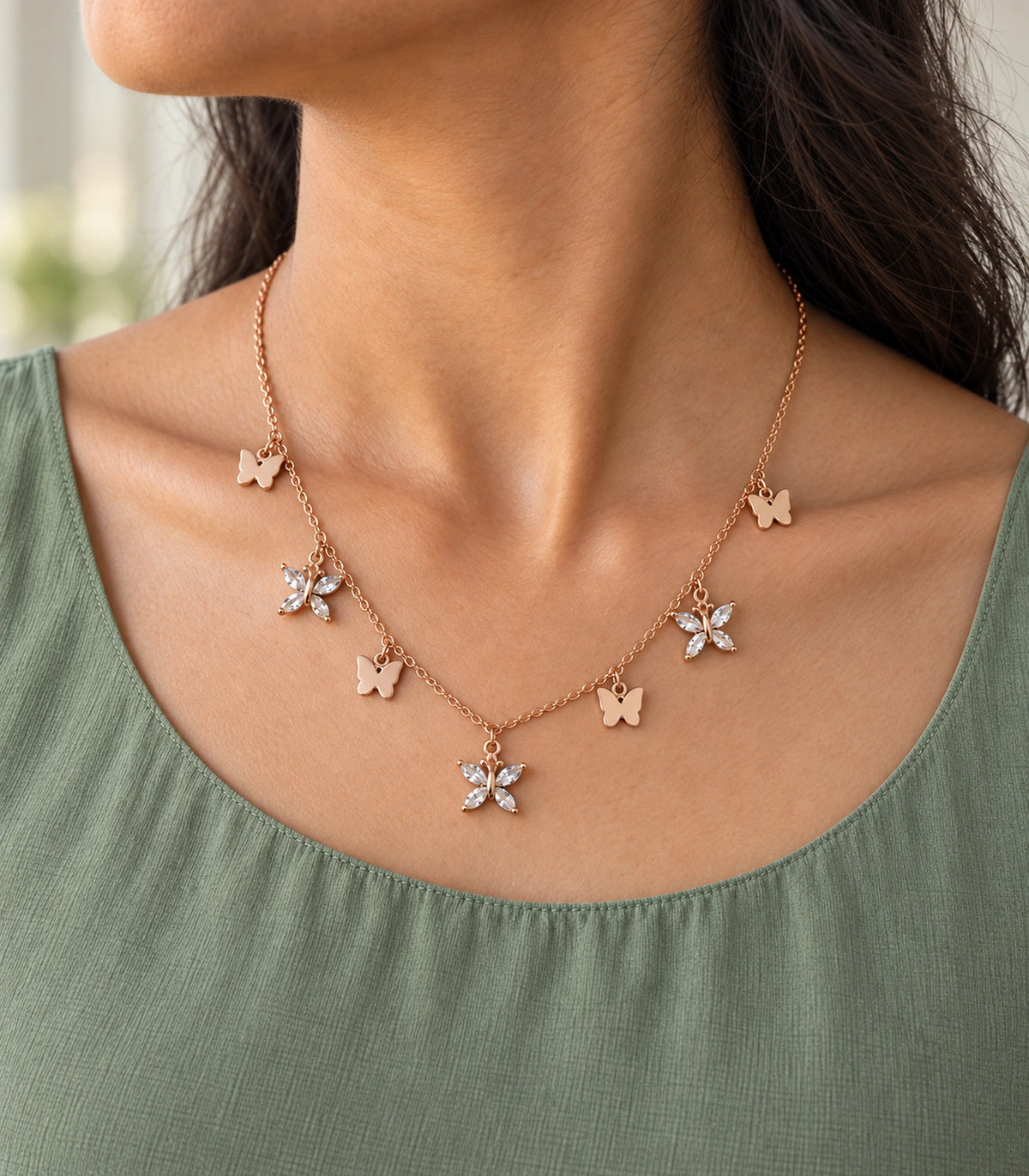 JIMIKI Rose Gold Mixed Butterfly Charm Necklace in Rose Gold - editorial worn view #color_rose-gold