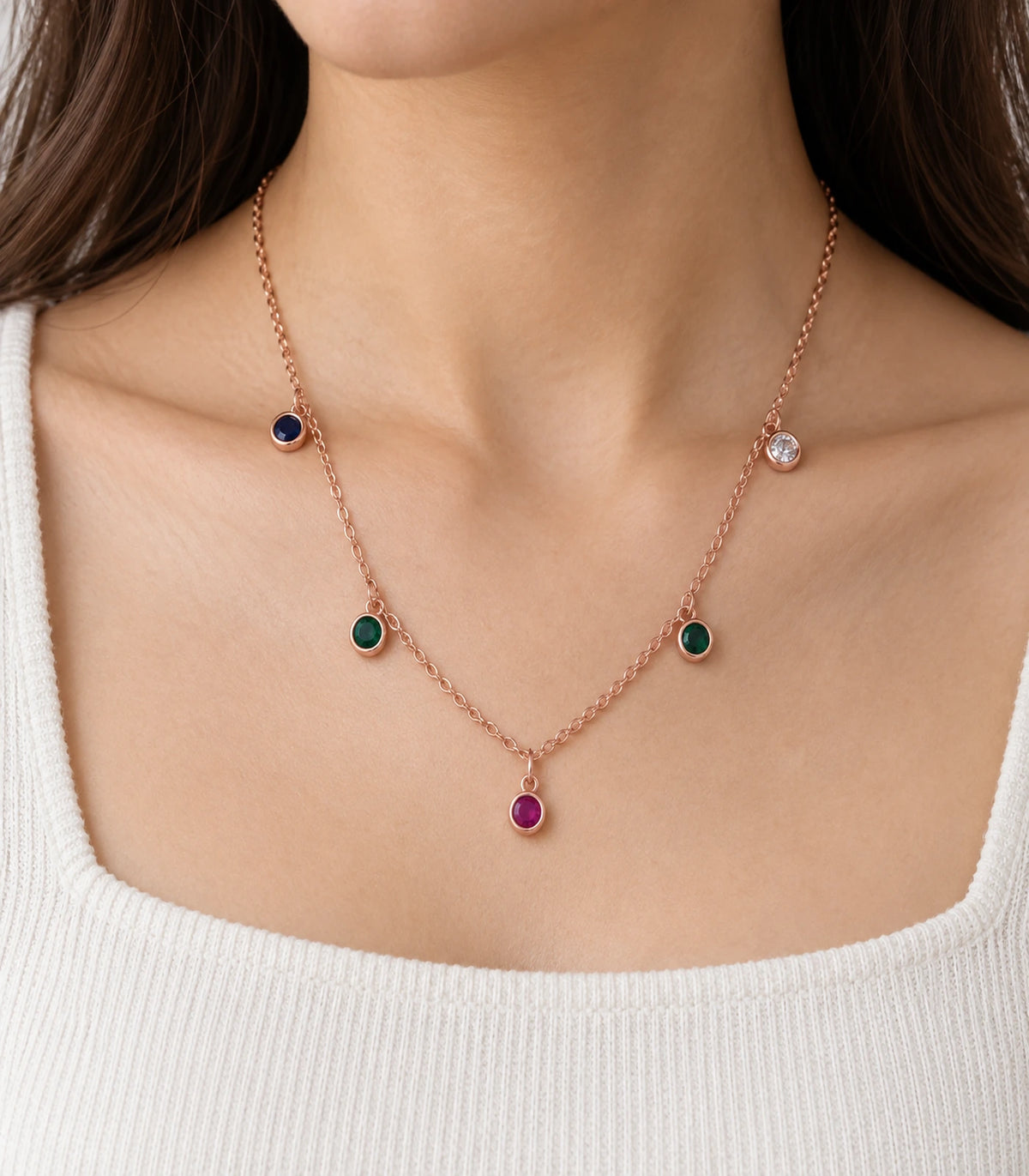 JIMIKI Rose Gold Multicolor Five-Stone Station Necklace, close-up of blue, green, magenta and clear round accents #color_multicolour