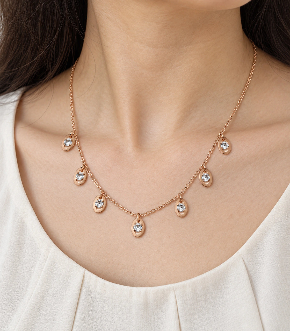 JIMIKI Rose Gold Oval Crystal Charm Necklace in Rose Gold - close-up details #color_rose-gold