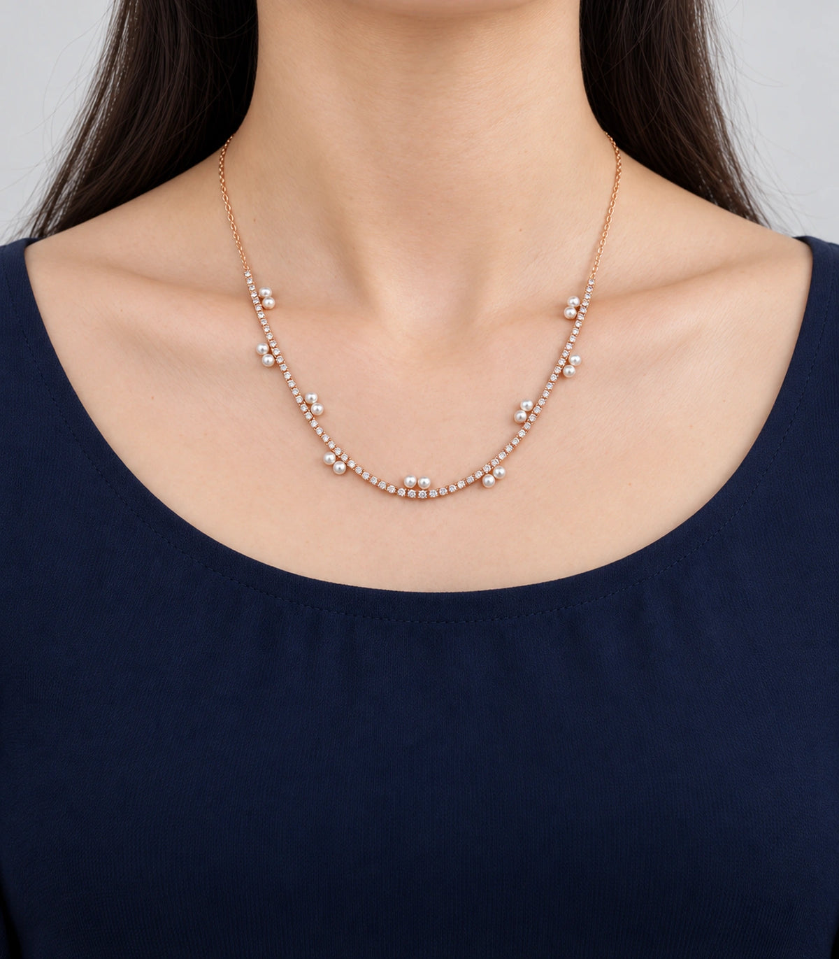 JIMIKI Rose Gold Paired Pearl Crystal Tennis Necklace in Rose Gold - worn styling view #color_rose-gold