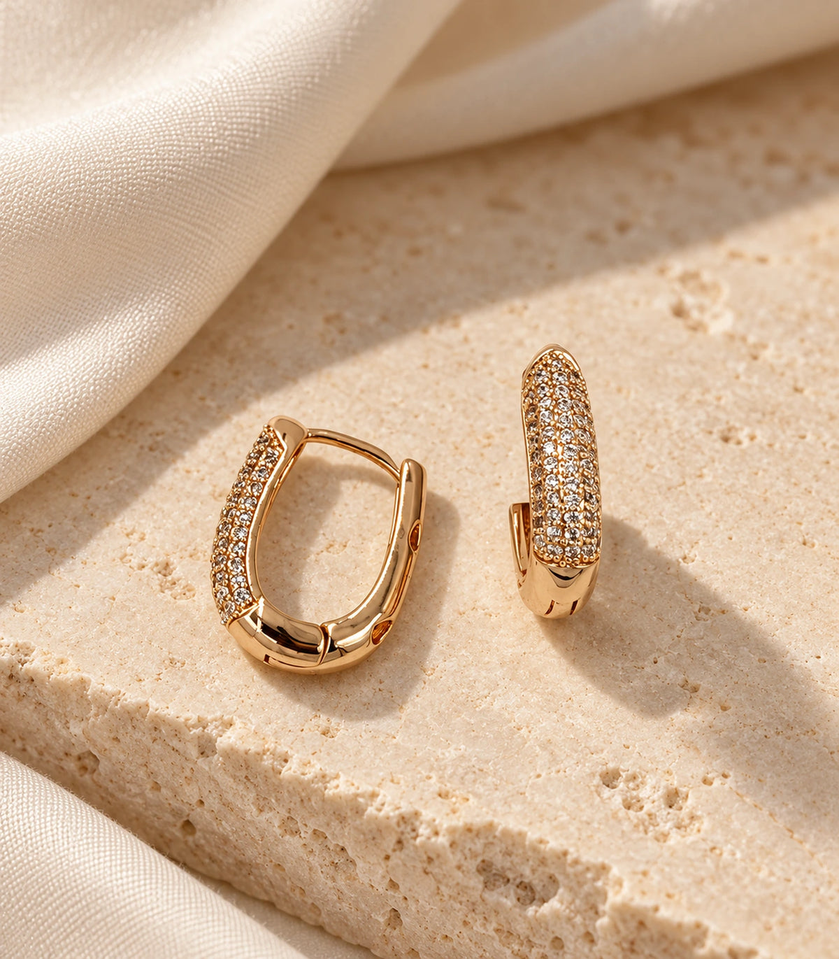 JIMIKI Pave Bar Huggie Hoop Earrings in Rose Gold Tone - editorial-flatlay #color_rose-gold-tone