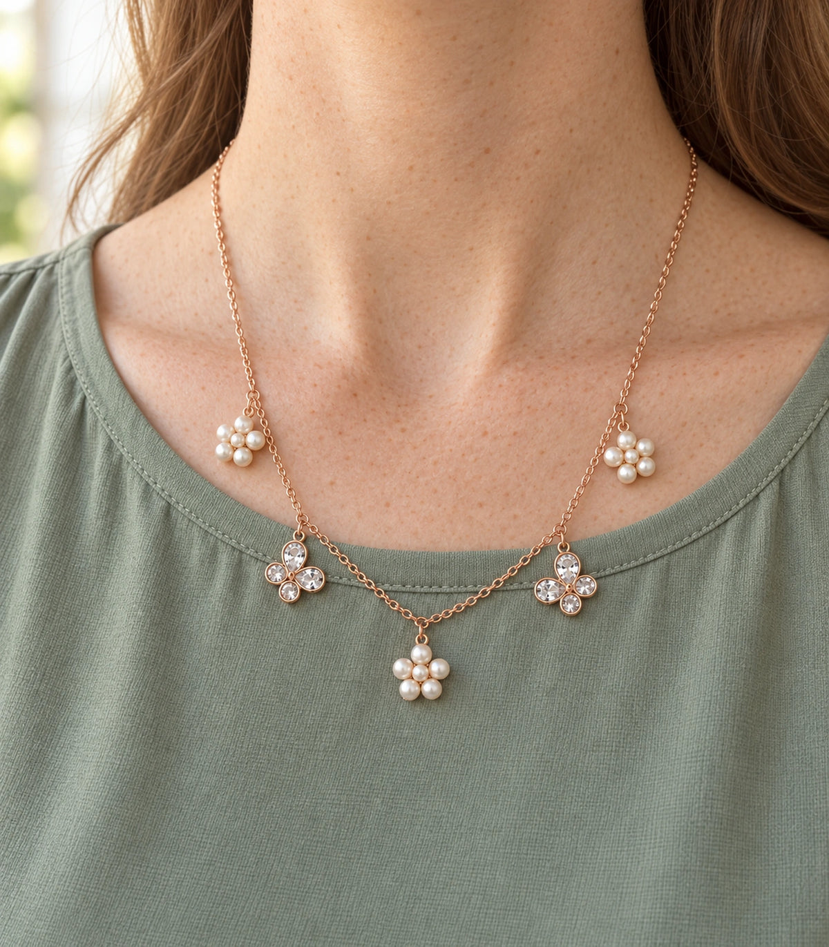 JIMIKI Rose Gold Pearl Flower Crystal Butterfly Necklace in Rose Gold - editorial worn view #color_rose-gold