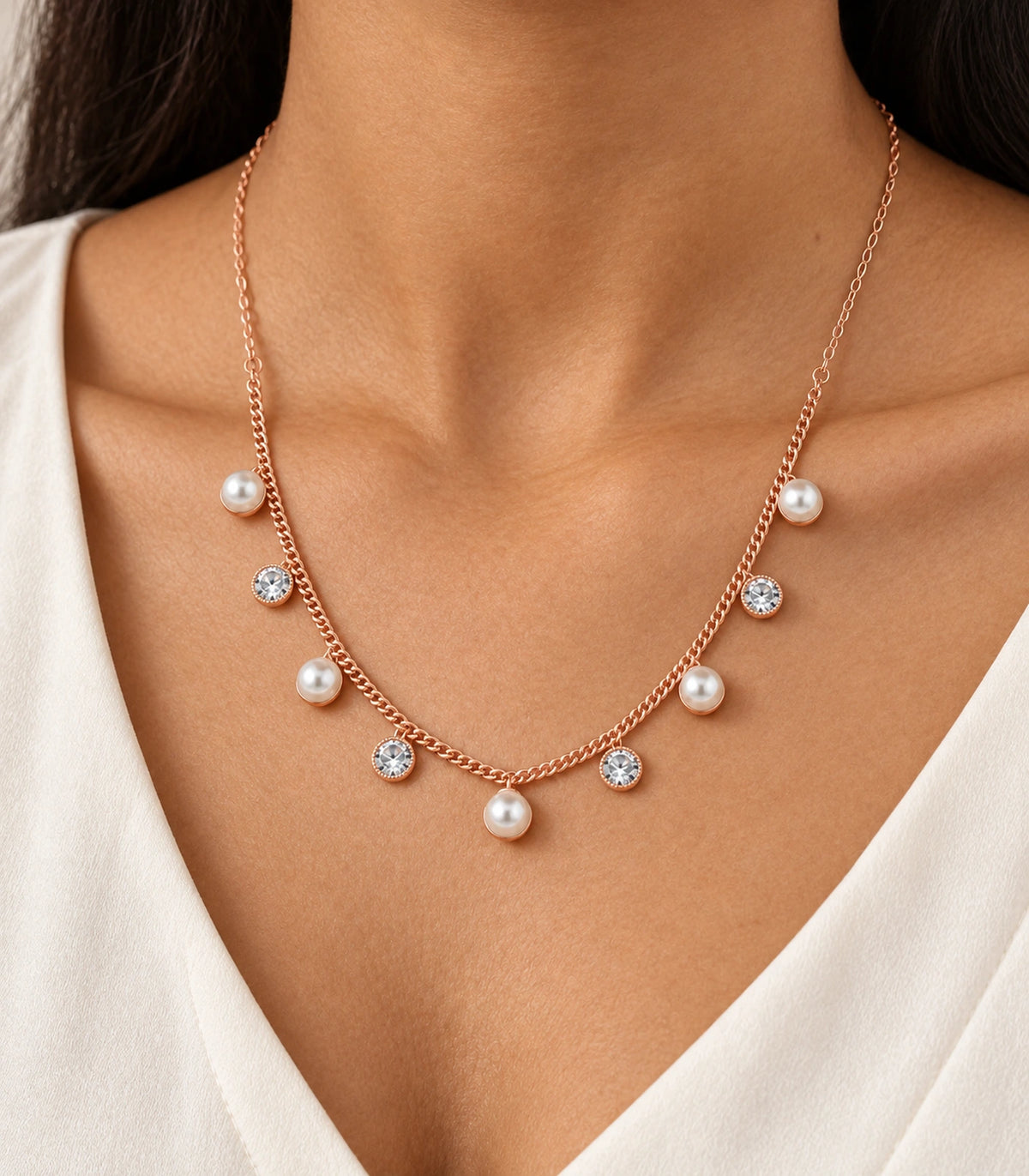 JIMIKI Rose Gold Pearl Round Crystal Charm Necklace in Rose Gold - close-up details #color_rose-gold