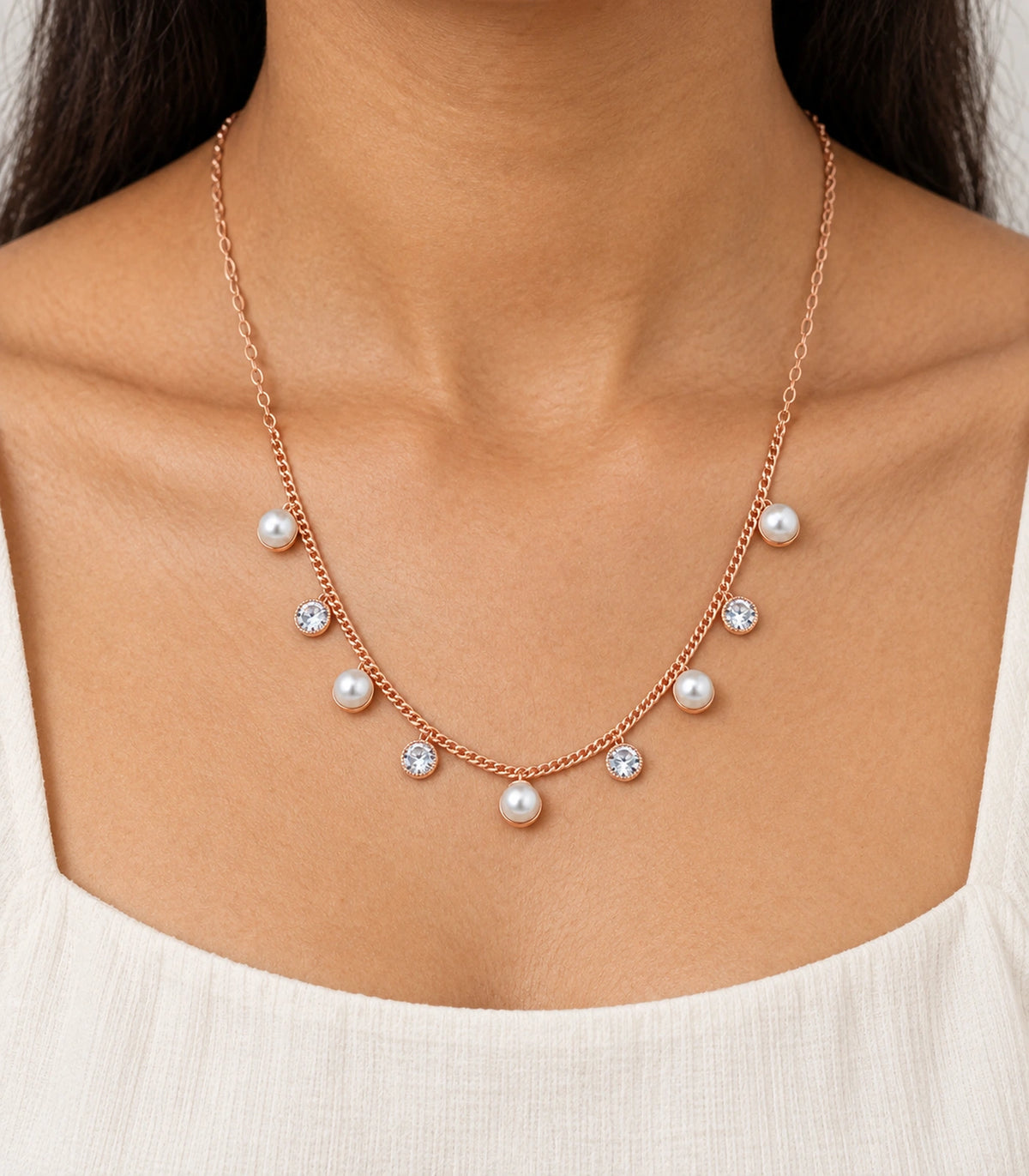 JIMIKI Rose Gold Pearl Round Crystal Charm Necklace in Rose Gold - worn styling view #color_rose-gold