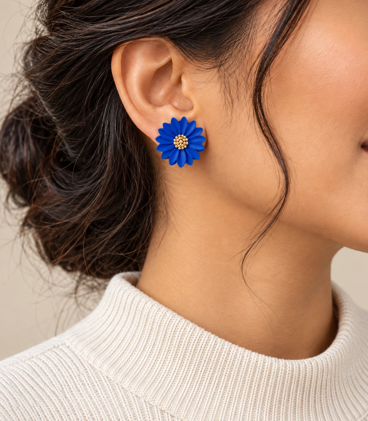 JIMIKI Royal Blue layered starburst daisy stud earrings, editorial portrait of the daisy stud worn at the ear #color_royal blue