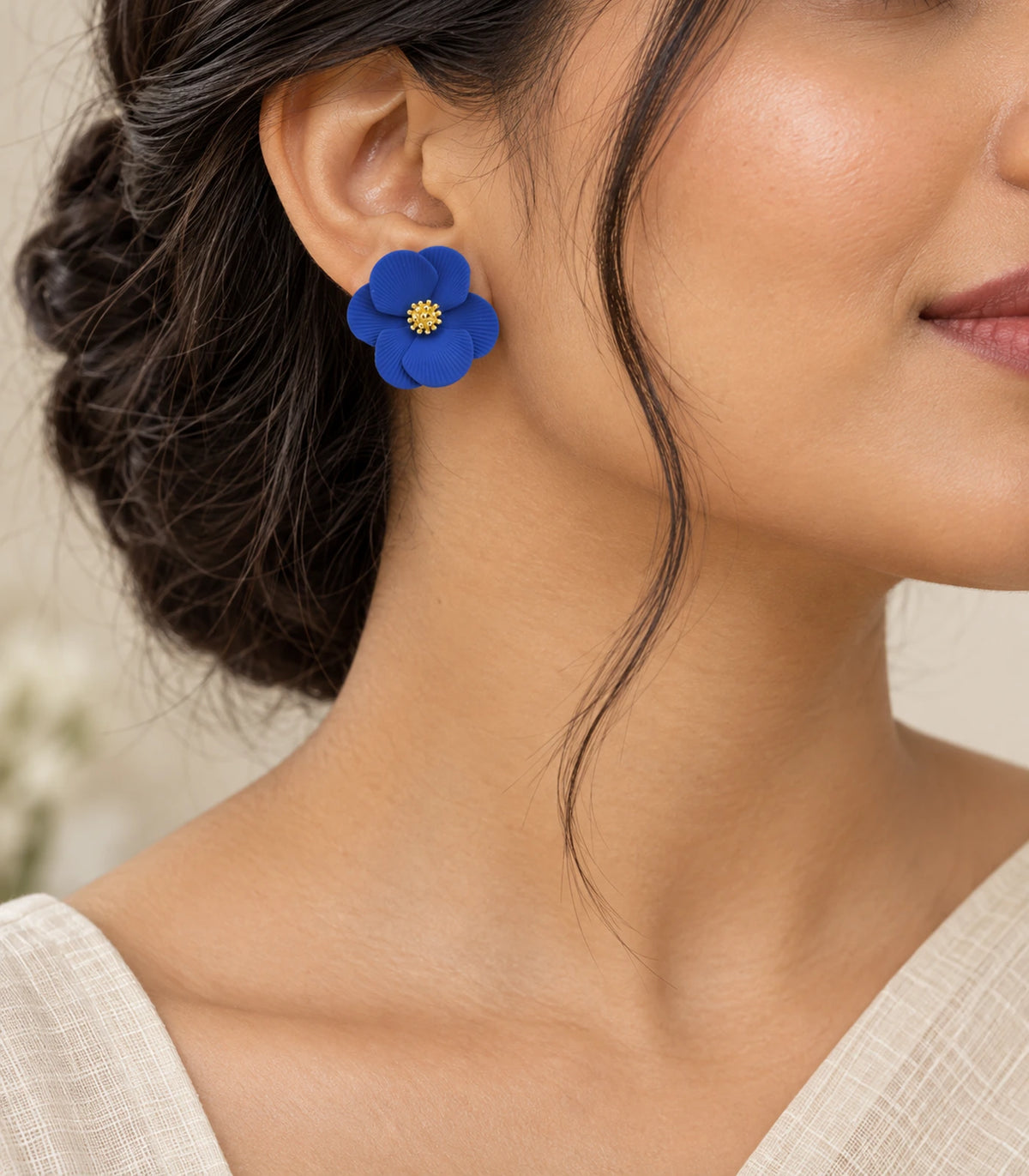 JIMIKI Royal Blue ribbed flower stud earrings, styled worn editorial view #color_royal blue