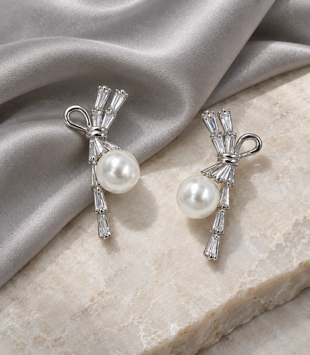 JIMIKI Silver Baguette Bow Pearl Drop Earrings - editorial-flatlay #color_silver