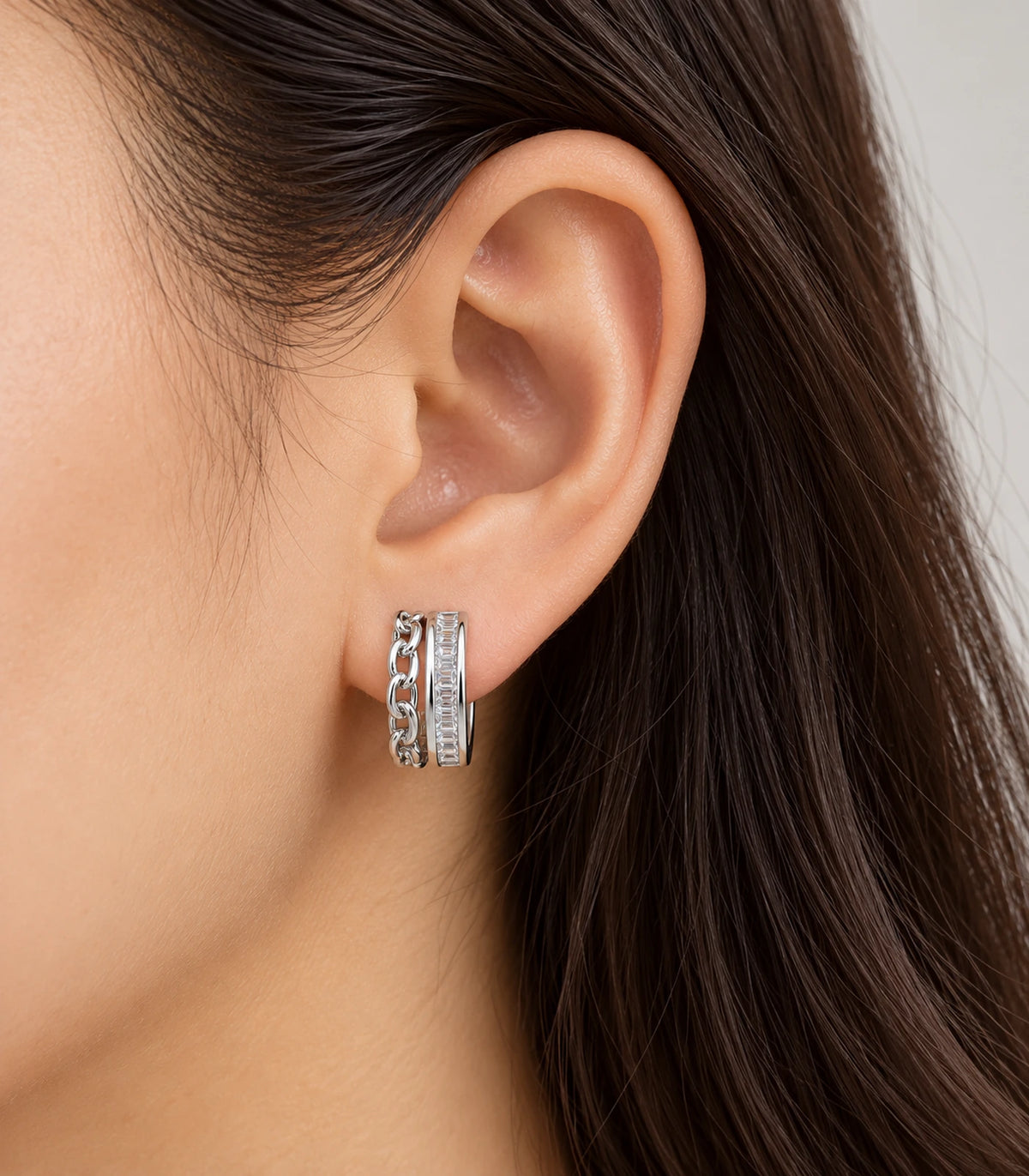 JIMIKI silver baguette chain double row huggie earrings, worn on the ear #color_silver
