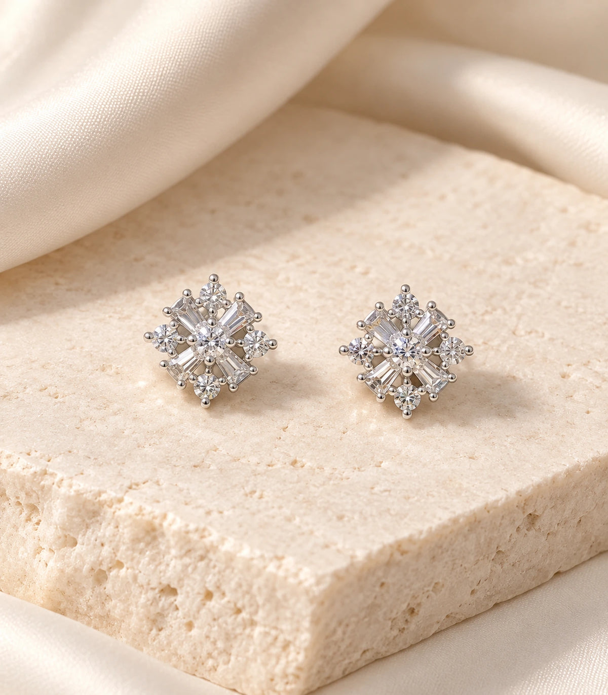 JIMIKI Silver Baguette and Round Cluster Stud Earrings — editorial flat lay #color_silver
