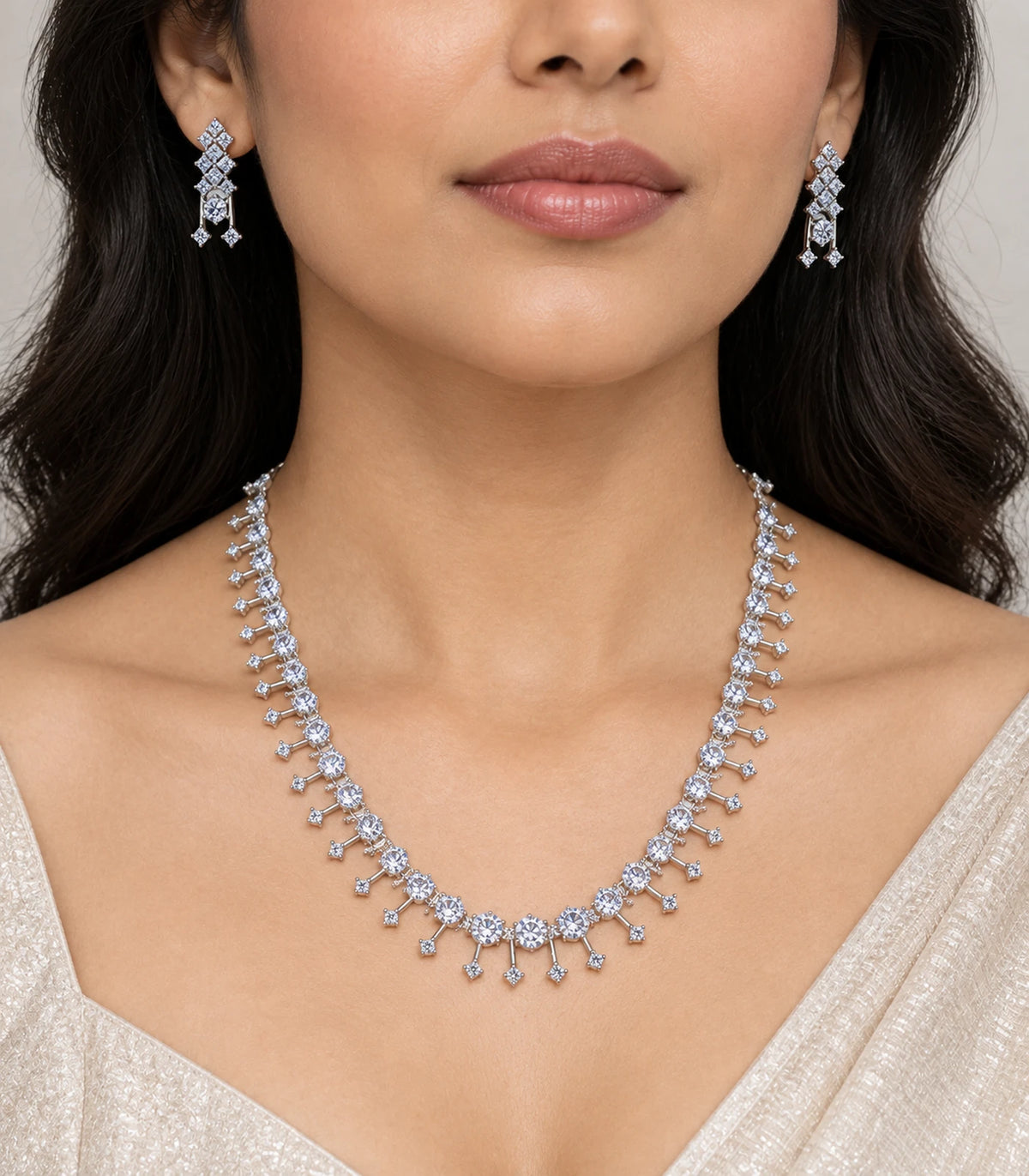 Silver-tone clear fringe necklace set with both matching earrings worn