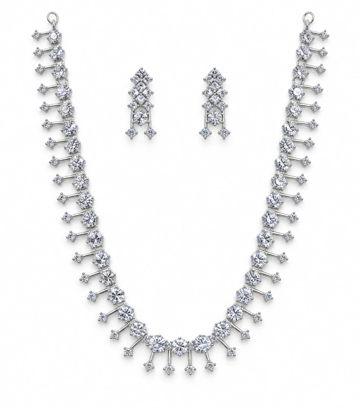 Silver-tone clear crystal necklace and matching pair of earrings on white